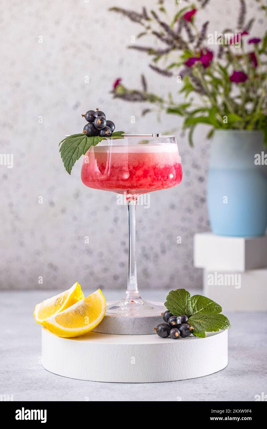 Elegant glass of Black Currant Gin Sour cocktail or mocktails