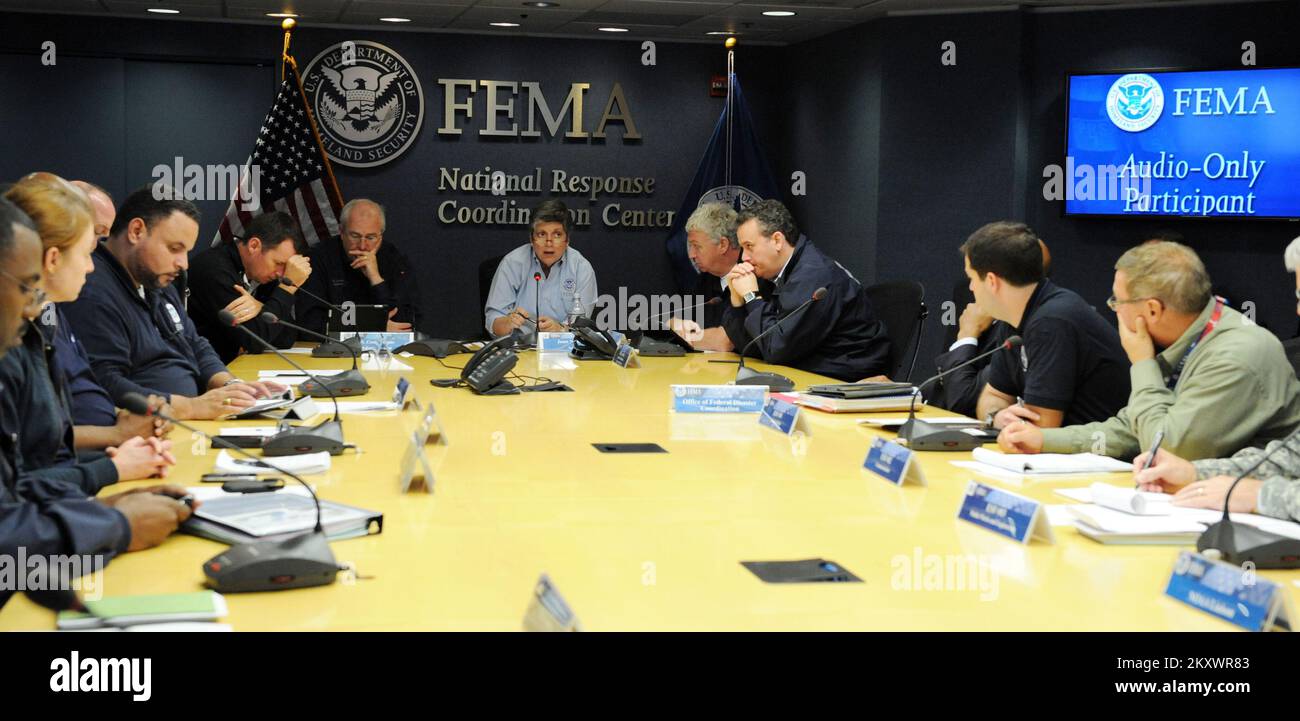 Washington, D.C., Oct. 30, 2012   Department of Homeland Security Secretary Janet Napolitano, center, and FEMA Administrator Craig Fugate, left, participate in a briefing at the National Response Coordination Center at FEMA headquarters on October 30, 2012. Washington, DC, USA--Department of Homeland Security Secretary Janet Napolitano, center, and FEMA Administrator Craig Fugate, left, participate in a briefing at the National Response Coordination Center at FEMA headquarters on October 30, 2012.. Photographs Relating to Disasters and Emergency Management Programs, Activities, and Officials Stock Photo