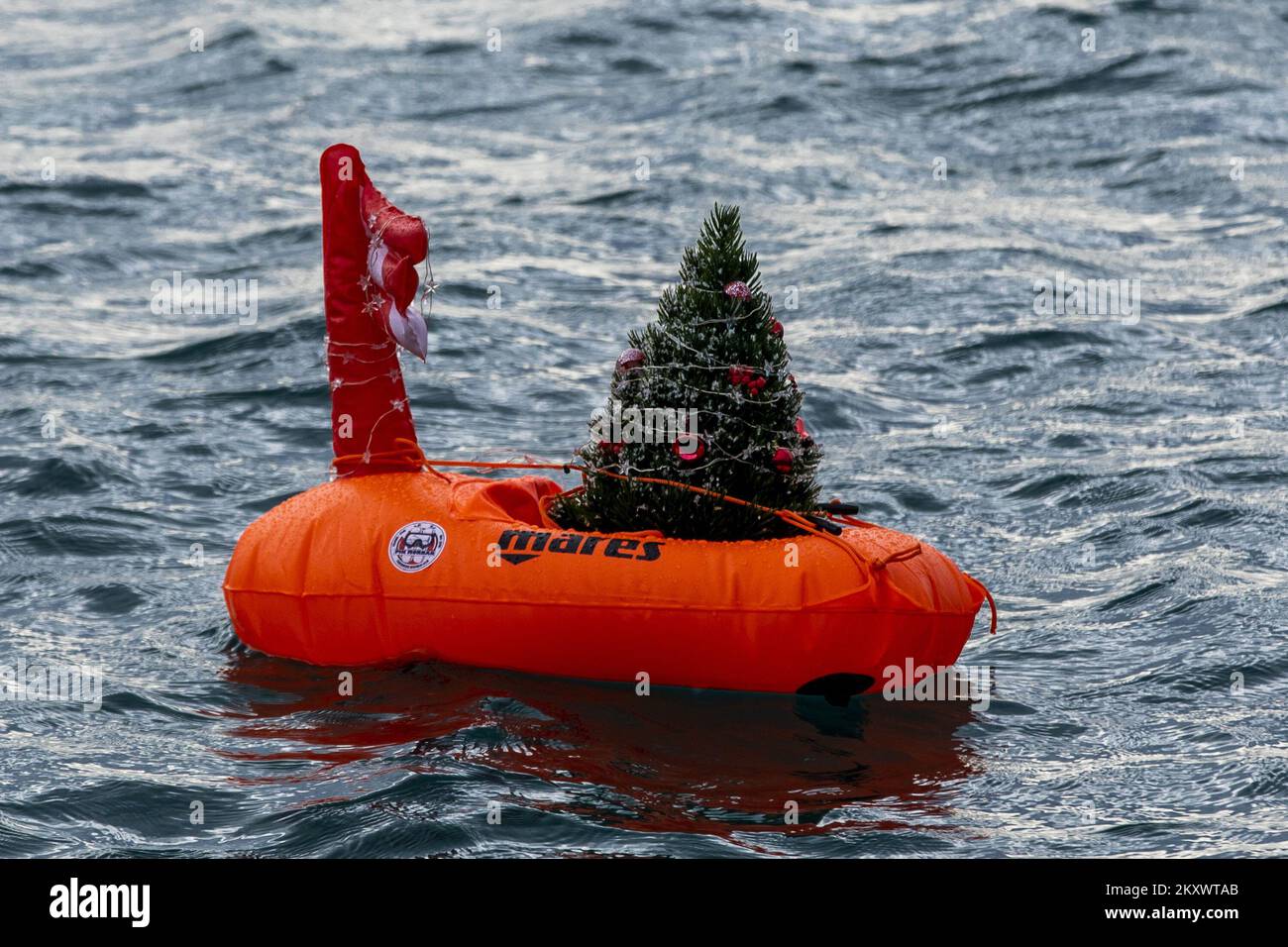 An ornate Christmas tree floats in the sea in Split on December 24