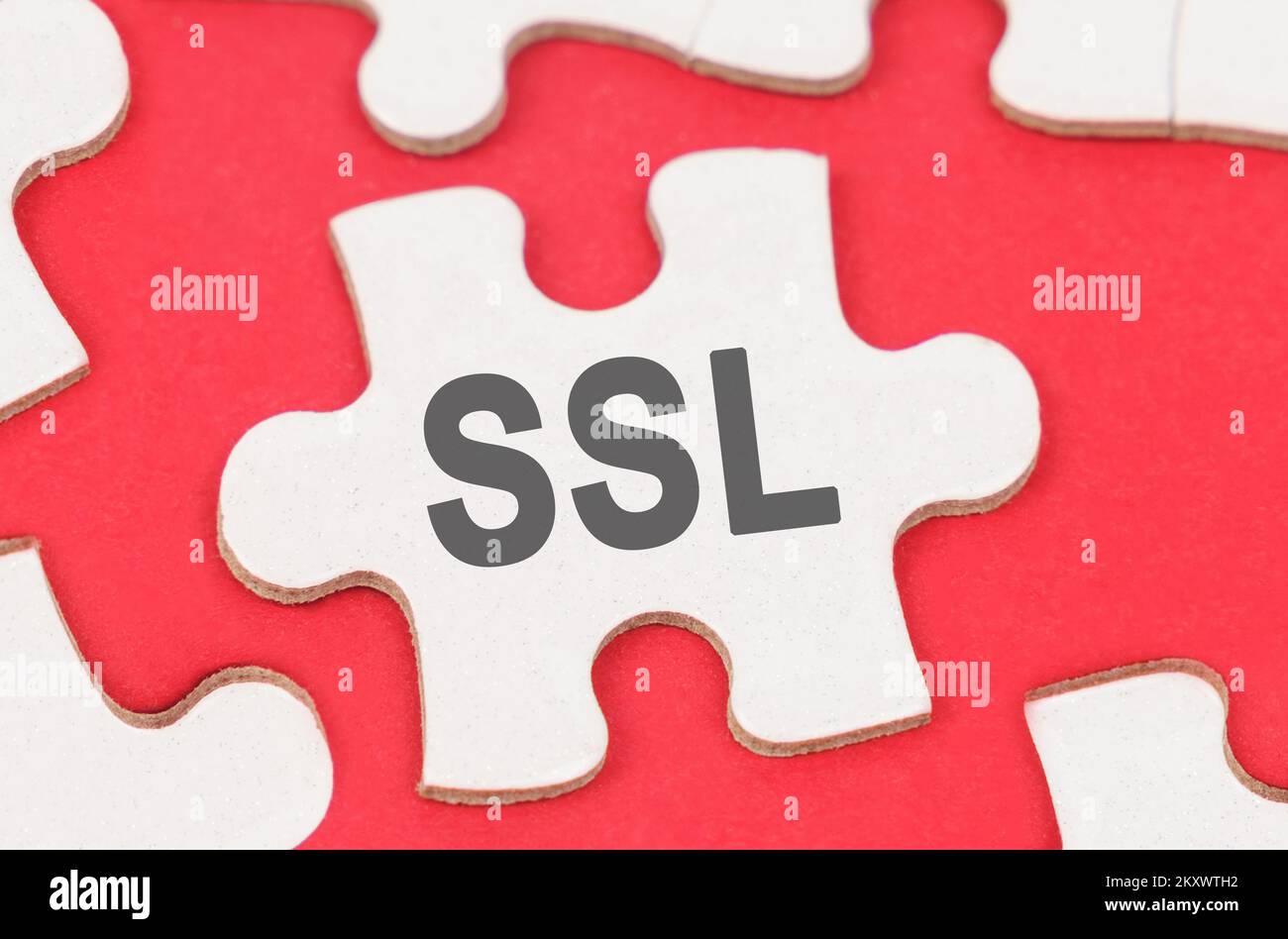 Internet and security. On a red background, among white puzzles lies a ...