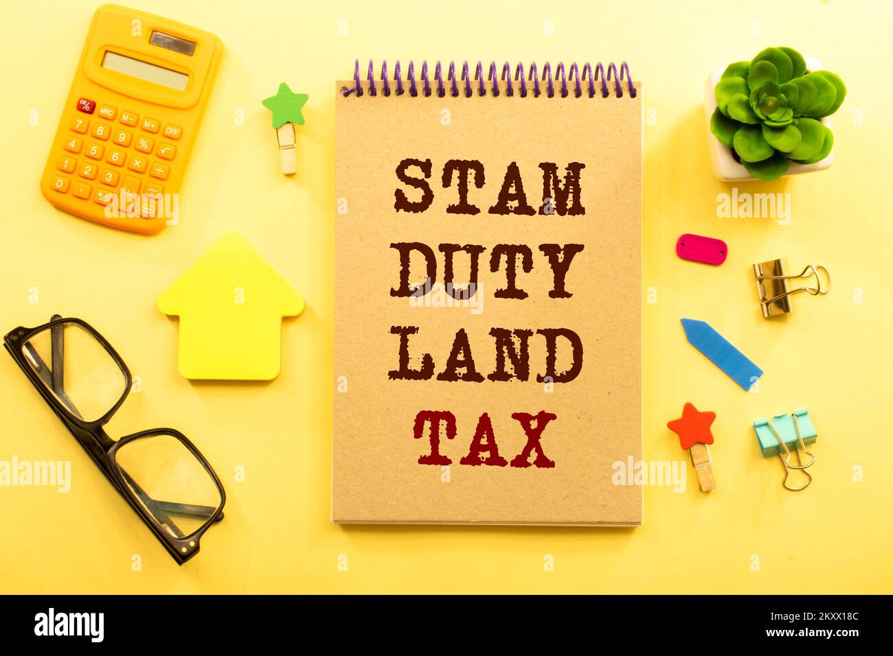 SDLT - Stamp Duty Land Tax write on a card on office desk Stock Photo