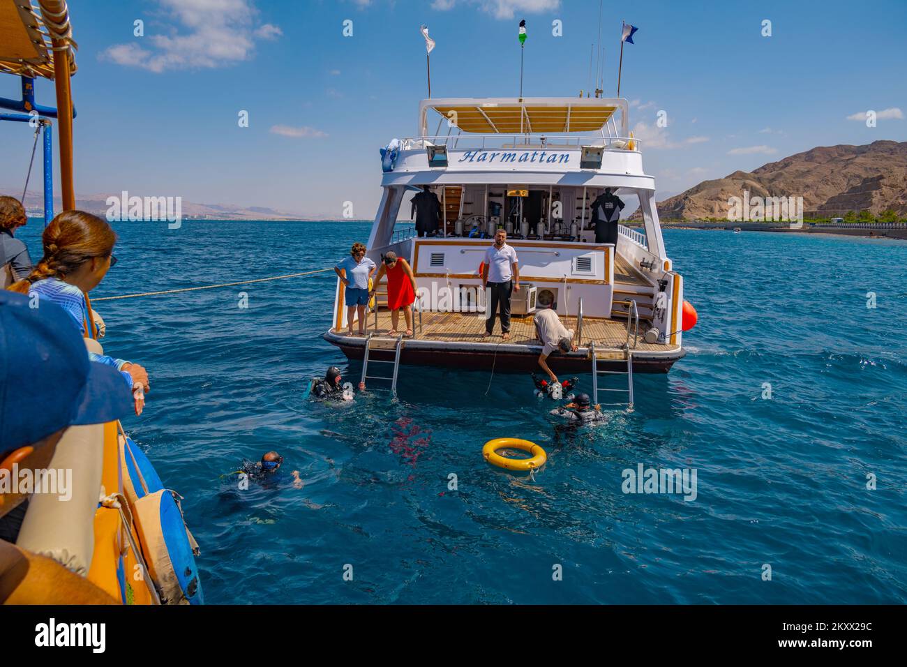 Snorkelling of the back of a tourist boat in the Red Sea at Aqaba in