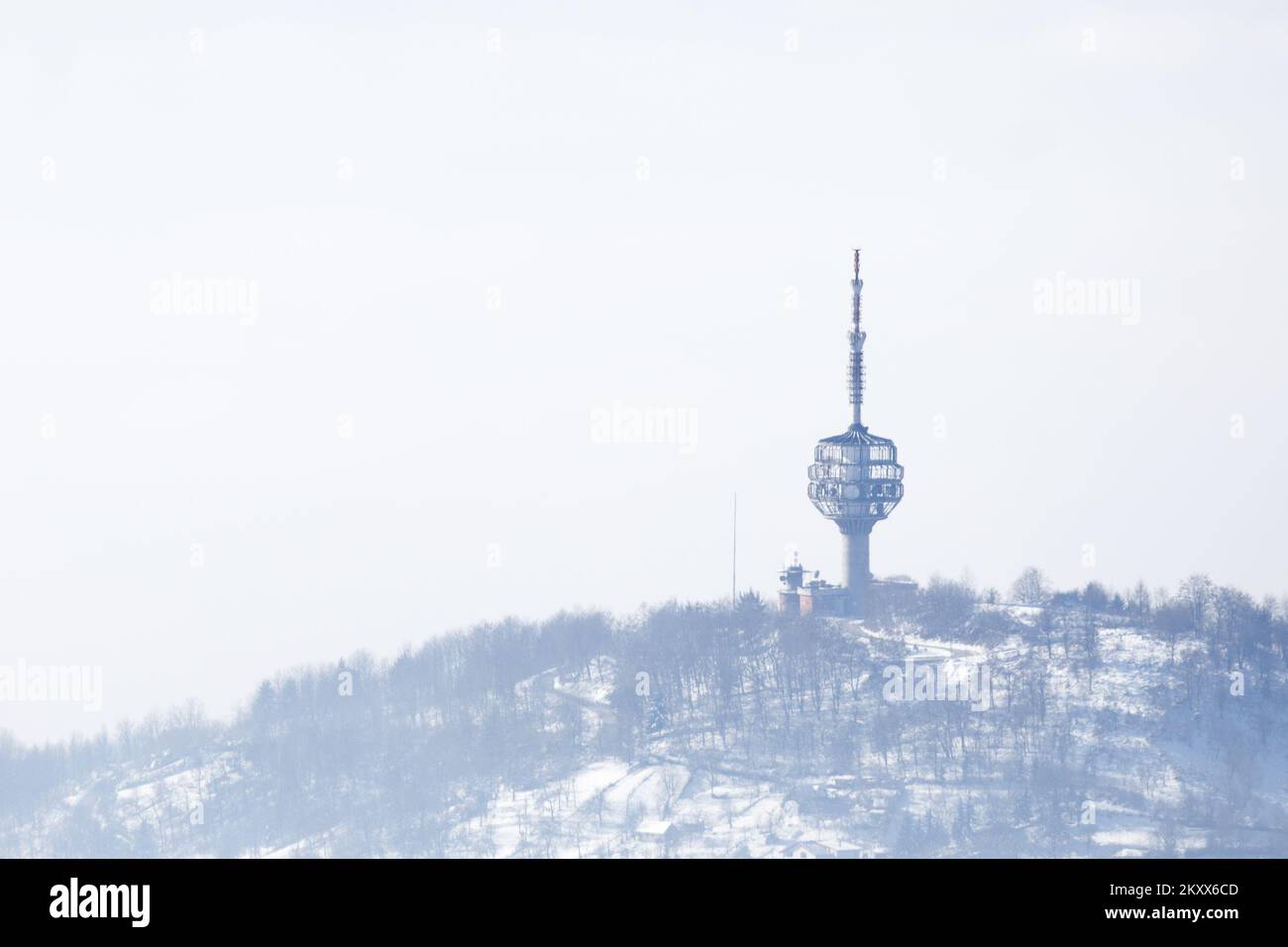 Hum antenna tower breaks through fog and smog in Sarajevo, Bosnia and ...