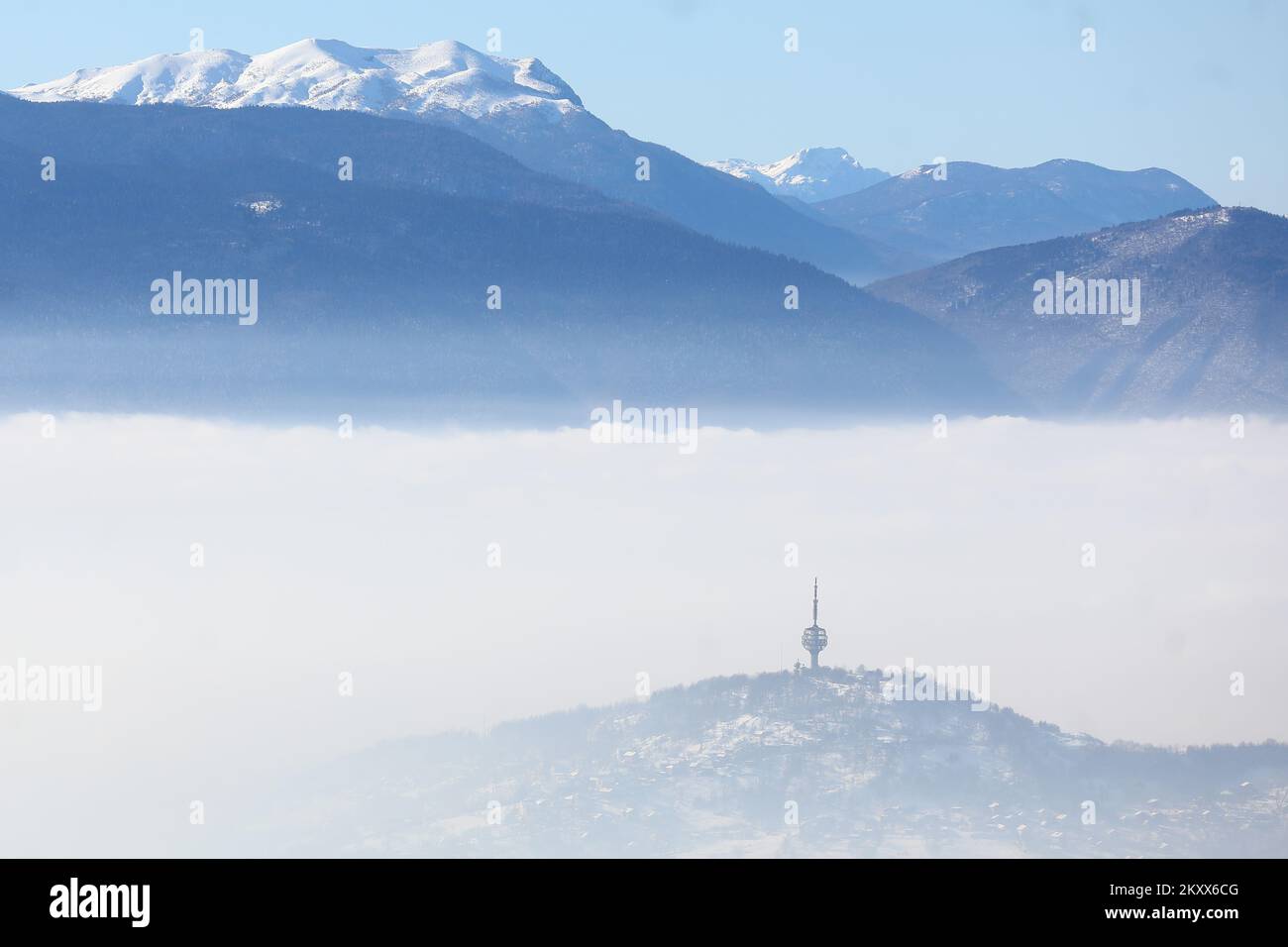 Hum antenna tower breaks through fog and smog in Sarajevo, Bosnia and ...