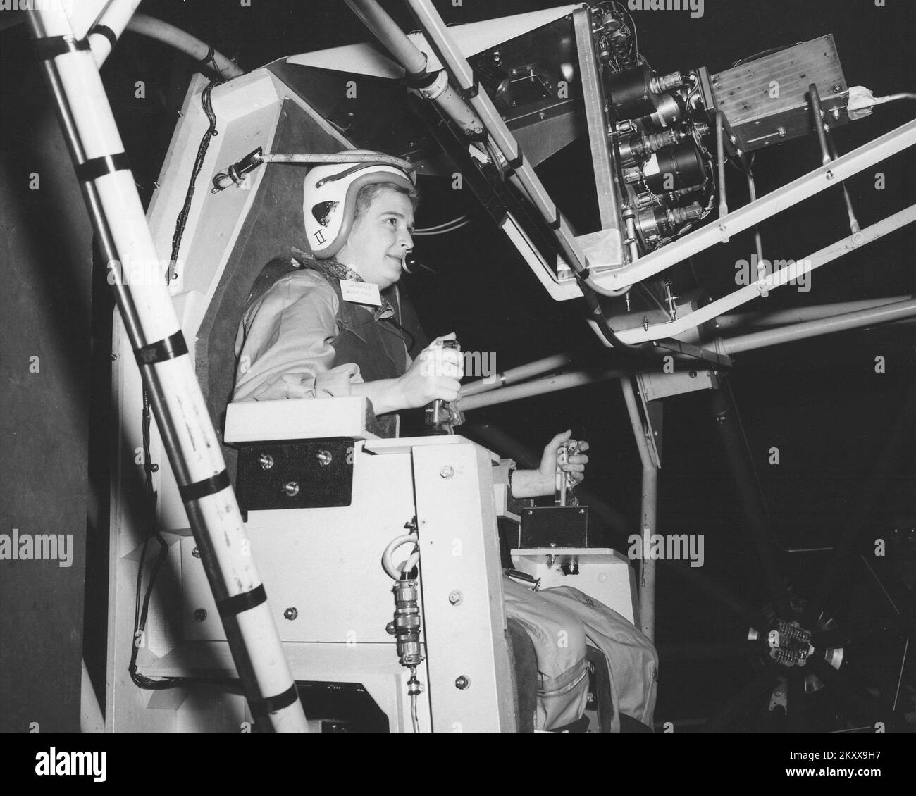 errie Cobb, a well-known woman pilot in the 1950s, flies the Gimbal Rig in the Altitude Wind Tunnel, (AWT) in April 1960 at the Lewis Research Center (now Glenn Research Center). The Gimbal Rig, formally called MASTIF or Multiple Axis Space Test Inertia Facility, was used to train the Mercury 7 astronauts to control the spin of a tumbling spacecraft. As part of a privately funded initiative Jerrie Cobb was the first woman to pass all three phases of the Mercury astronaut screening program. April 6, 1960 Stock Photo
