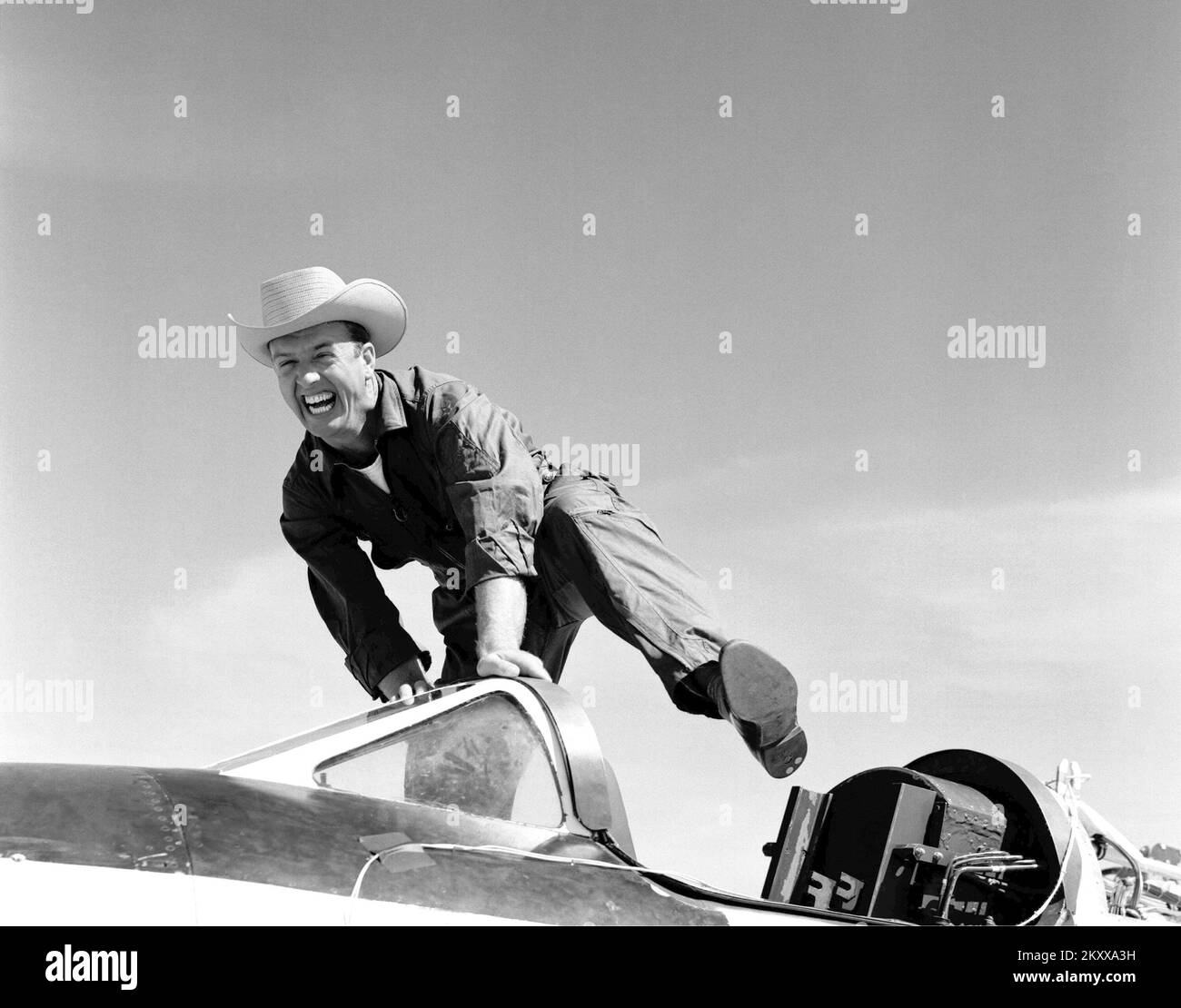 Cowboy Joe (NACA High-Speed Flight Station test pilot Joseph Walker) and his steed (Bell Aircraft Corporation X-1A). A happy Joe was photographed in 1955 at Edwards, California. The X-1A was flown six times by Bell Aircraft Company pilot Jean 'Skip' Ziegler in 1953. Air Force test pilots Major Charles 'Chuck' Yeager and Major Arthur 'Kit' Murray made 18 flights between November 21, 1953 and August 26, 1954. The X-1A was then turned over to the NACA. Joe Walker piloted the first NACA flight on July 20, 1955. Walker attemped a second flight on August 8, 1955 Stock Photo