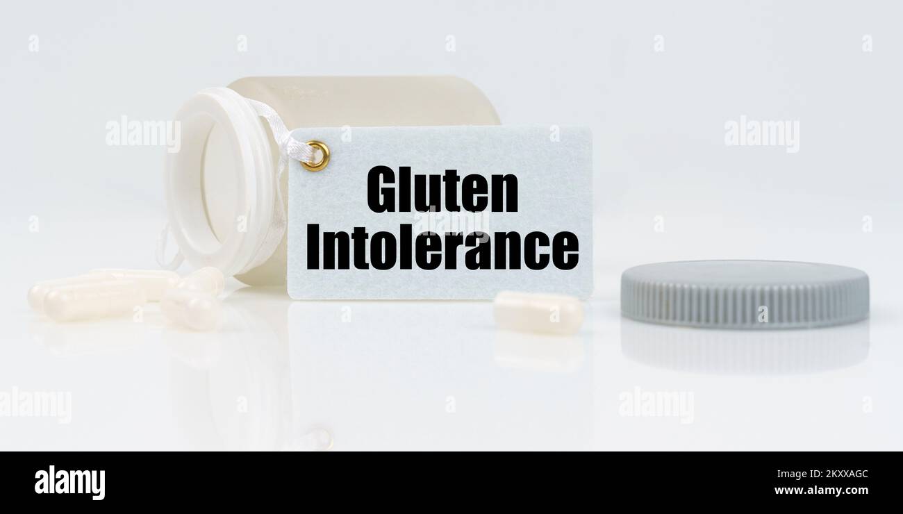 Medicine and health concept. On a white reflective background, there are pills and a jar of