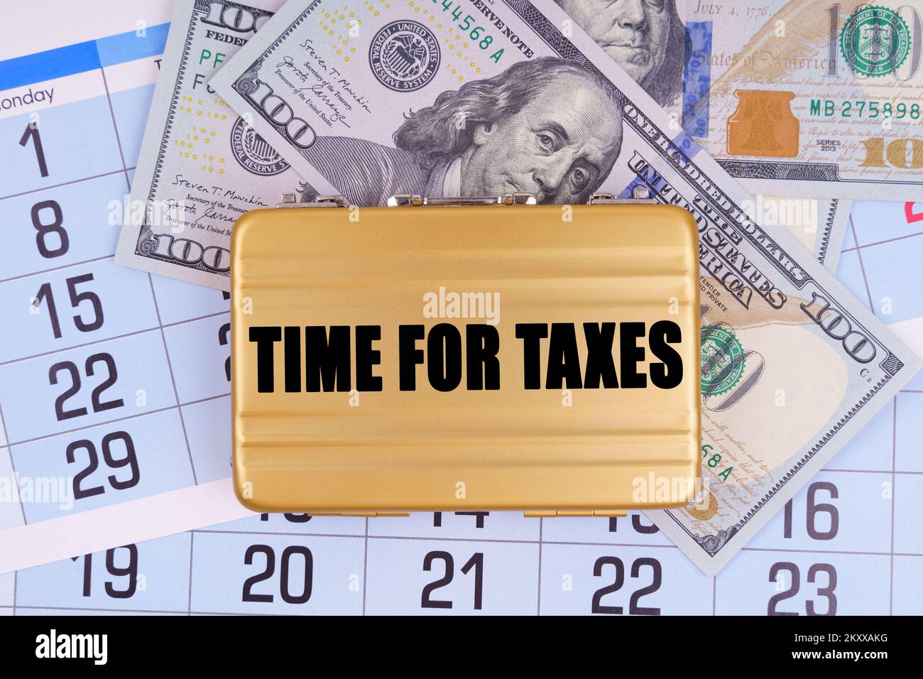 Business and finance. On the table lies a calendar, money and a