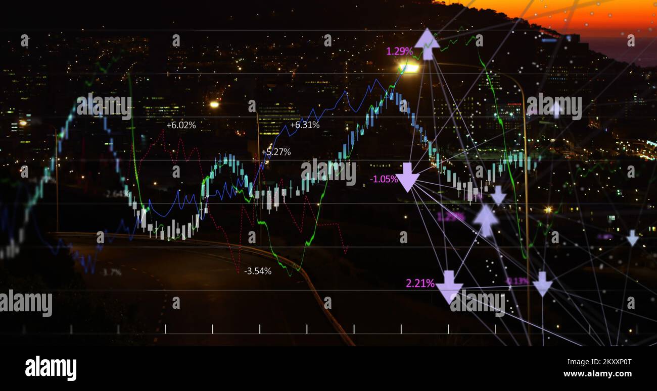 Financial curves over city by night. Stock Photo