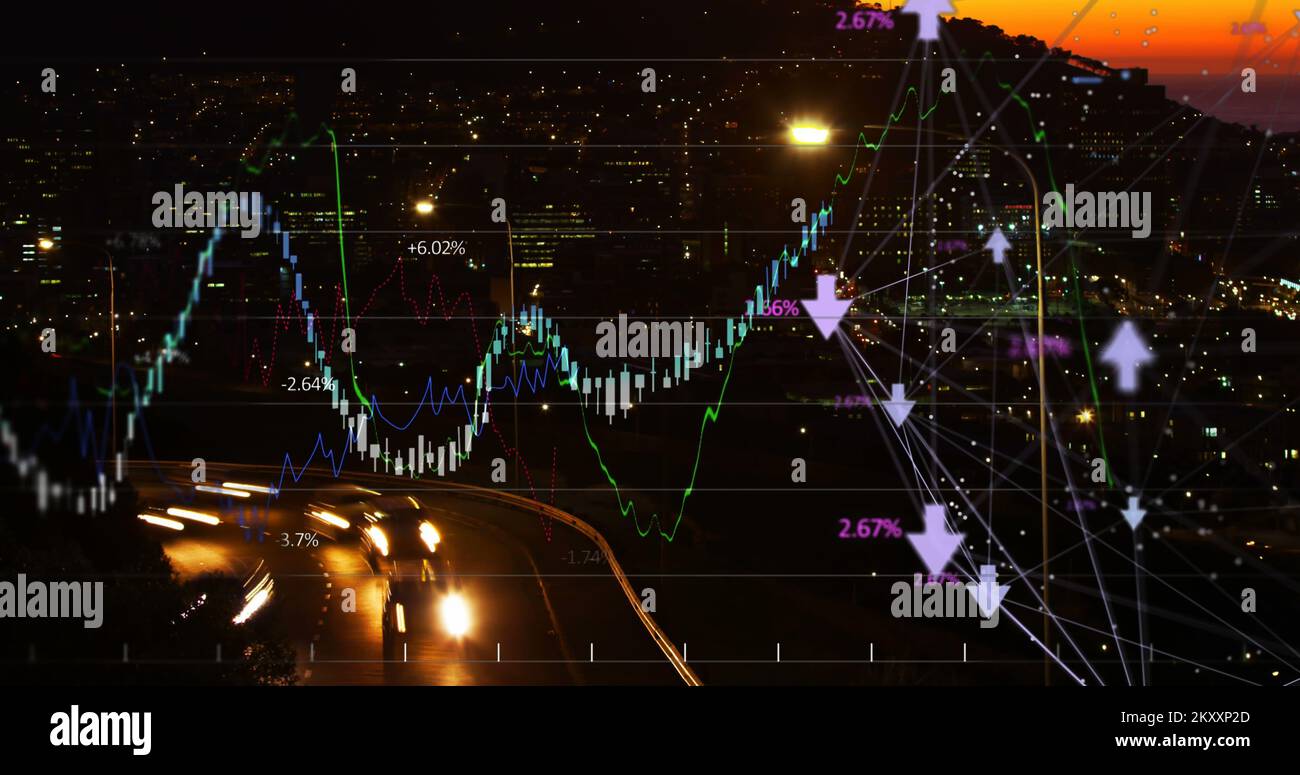 Financial curves over city by night. Stock Photo
