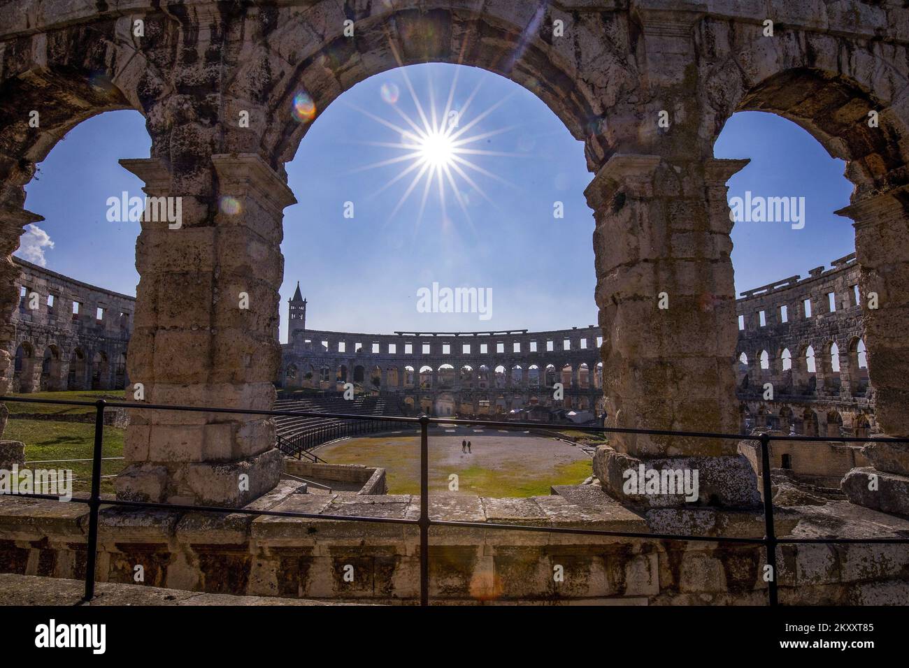 Photo taken on February 7, 2022 shows Pula Amphitheater , in Pula, Croatia.The Pula Amphitheater or Arena is one of the six largest Roman amphitheaters in the world. Erected in the 1st century during the reign of Emperor Vespasian, it was primarily used for gladiator fights in front of 20,000 spectators. Elliptic in shape (132 x 105 meters and 32 meters in height), the largest ancient building in Istria is open for sightseeing during the day and becomes a perfect place for pop rock concerts, operas and ballets in nighttime, as well as the film festival with a 50-year tradition. Photo: Srecko N Stock Photo