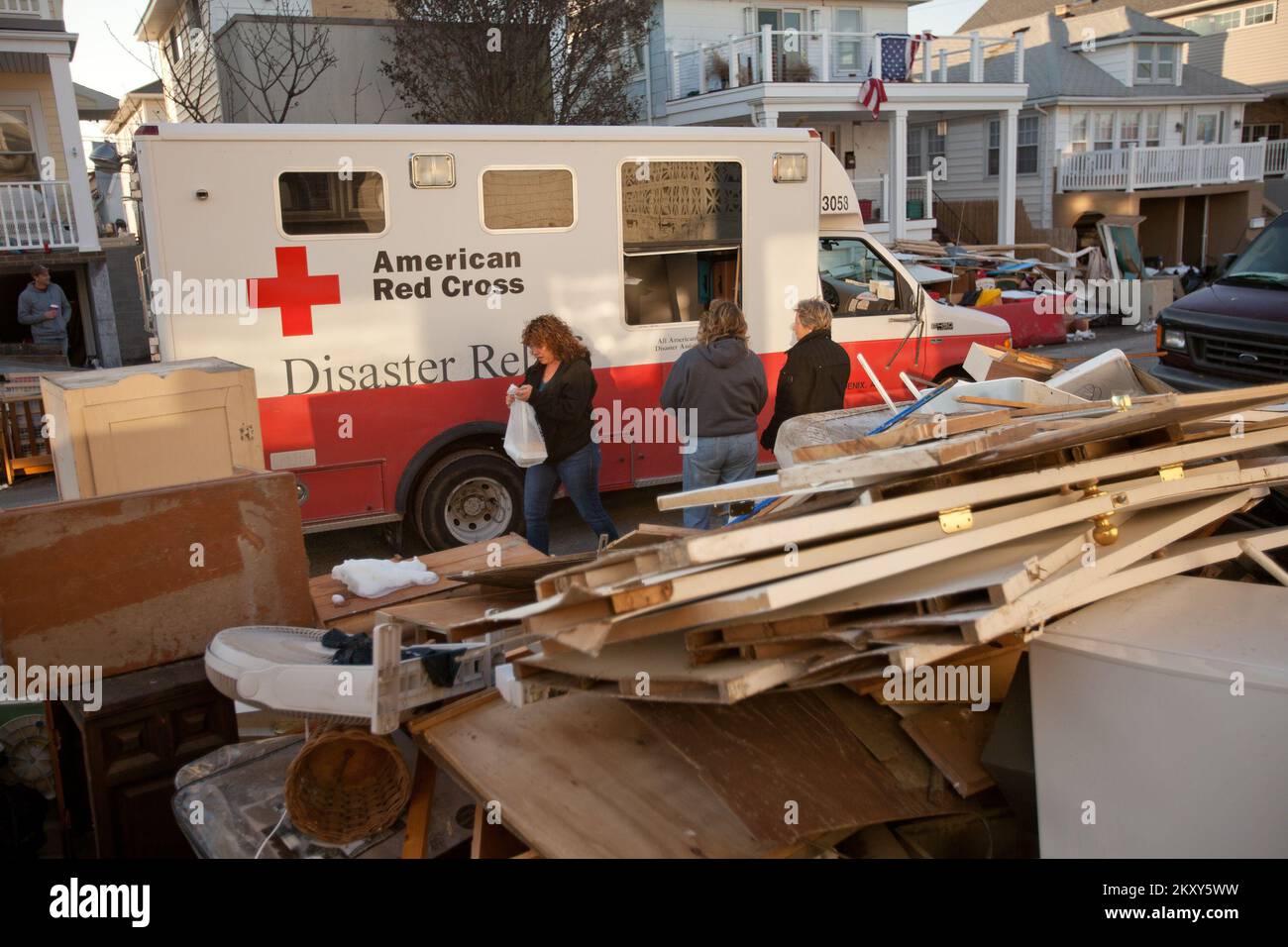 Long Island, N.Y., Nov. 9, 2012   The American Red Cross delivers food to Hurricane Sandy survivors in a Long Island neighborhood. The hurricane created widespread flooding, power outages and devastation to the area. FEMA is working with state and local officials to assist residents who were affected by Hurricane Sandy. Andrea Booher/FEMA. New York Hurricane Sandy. Photographs Relating to Disasters and Emergency Management Programs, Activities, and Officials Stock Photo