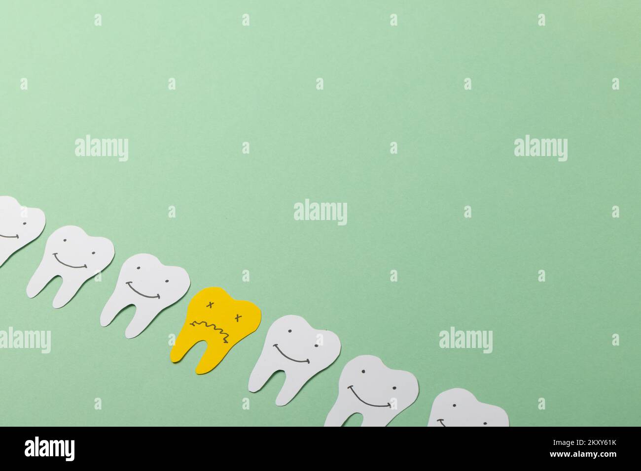 Close up of paper teeth on green background with copy space Stock Photo ...