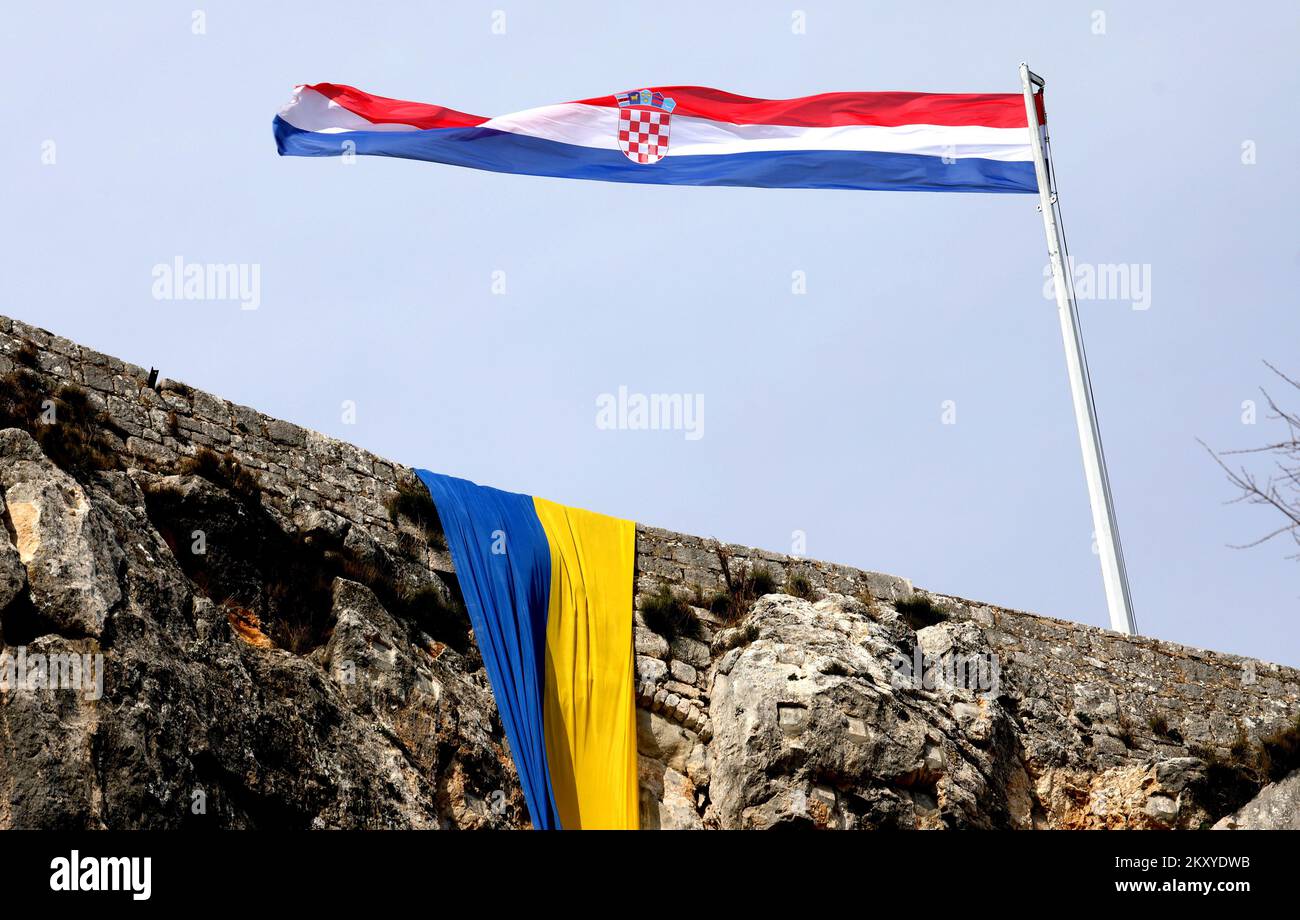 Ukraine flag is seen at Knin Fortress in solidarity with Ukrainian people after Russia's attack in Ukraine in Knin, Croatia on March 5, 2022. Photo: Dusko Jaramaz/PIXSELL Stock Photo