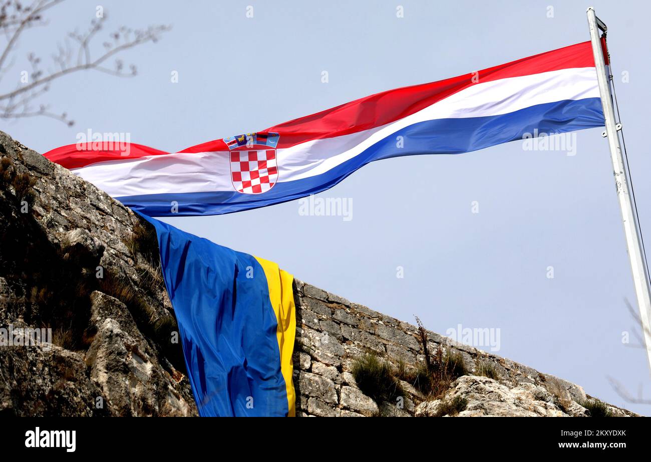 Ukraine flag is seen at Knin Fortress in solidarity with Ukrainian people after Russia's attack in Ukraine in Knin, Croatia on March 5, 2022. Photo: Dusko Jaramaz/PIXSELL Stock Photo