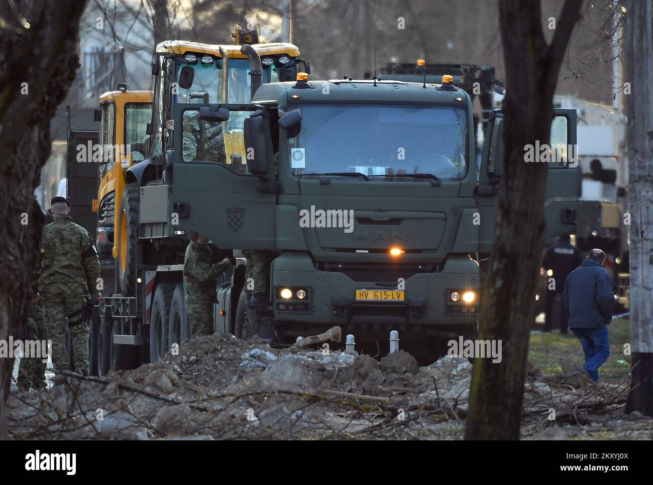 An excavator arrives at pilotless military aircraft crash site near Stjepan Radic student dorm in Zagreb, Croatia on March 11, 2022. According to the data collected so far, pilotless military aircraft, likely to be a Soviet-era Tu-141 Strizh severely malfunctioned entered Croatian airspace from the East to the West, from the airspace of Ukraine and Hungary, at a speed of 700 kph at an altitude of 1300 m. Photo: Marko Lukunic/PIXSELL Stock Photo