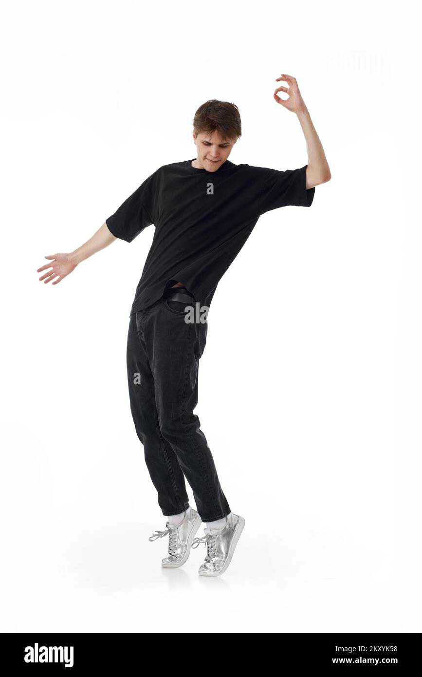 young-man-in-black-t-shirt-and-jeans-dancing-stock-photo-alamy
