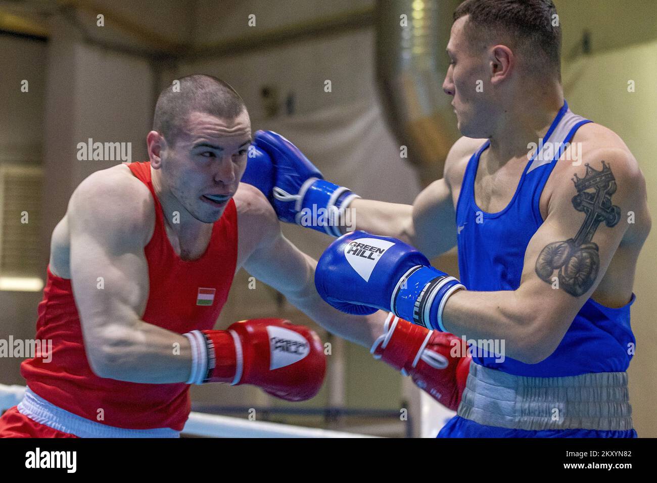 Istvan Gerzsenyi of Hungary (red) fights Narek Zakharyan of Armenia (blue) during the EUBC U22 European Boxing Championships Light Middleweight (67-71kg) match at Intersport Hall on March 15, 2022 in Porec, Croatia. Photo: Srecko Niketic/PIXSELL Stock Photo