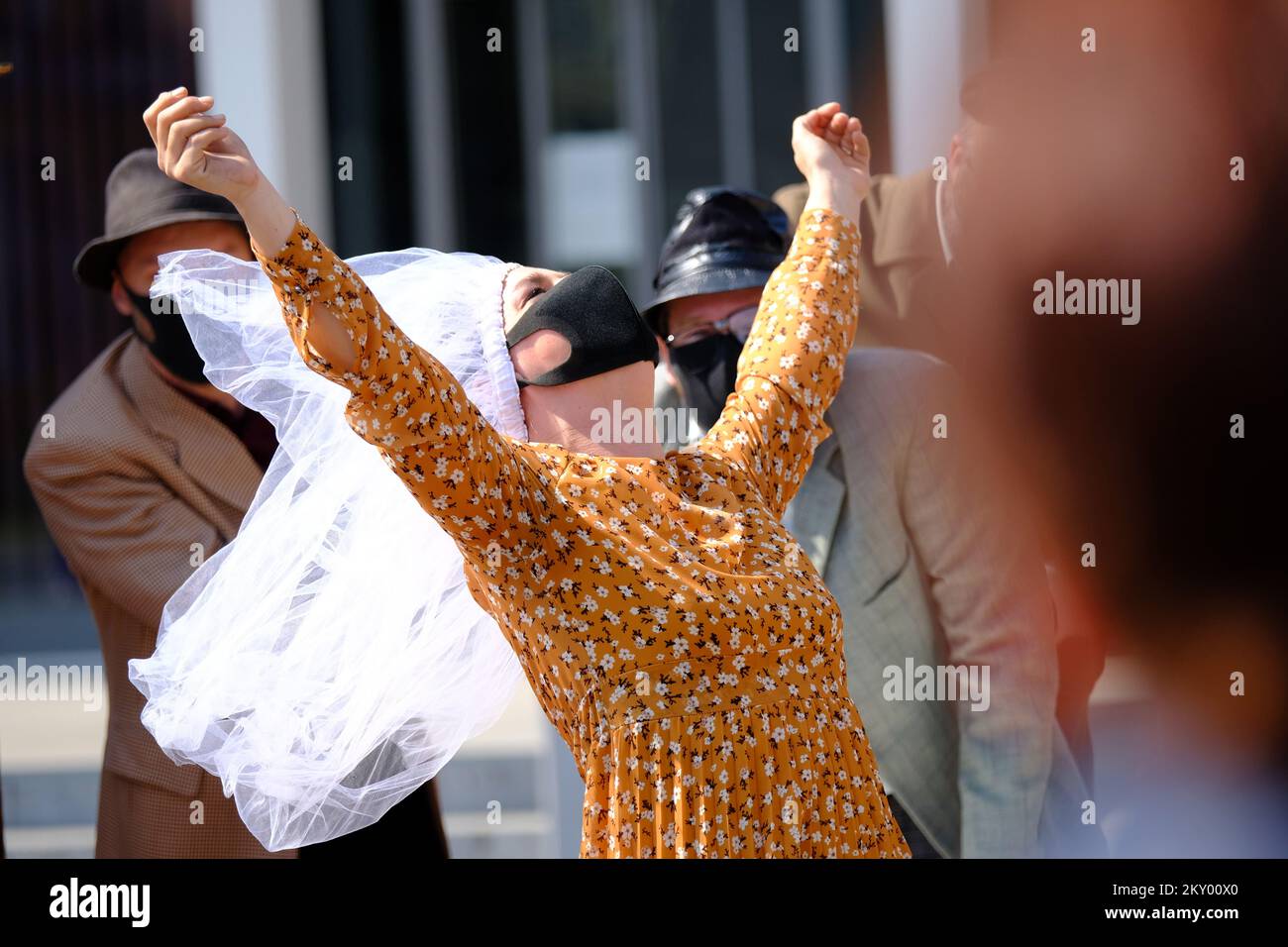 Actors wearing protective masks perform "Crotian way to happiness" play at Republic of Croatia
