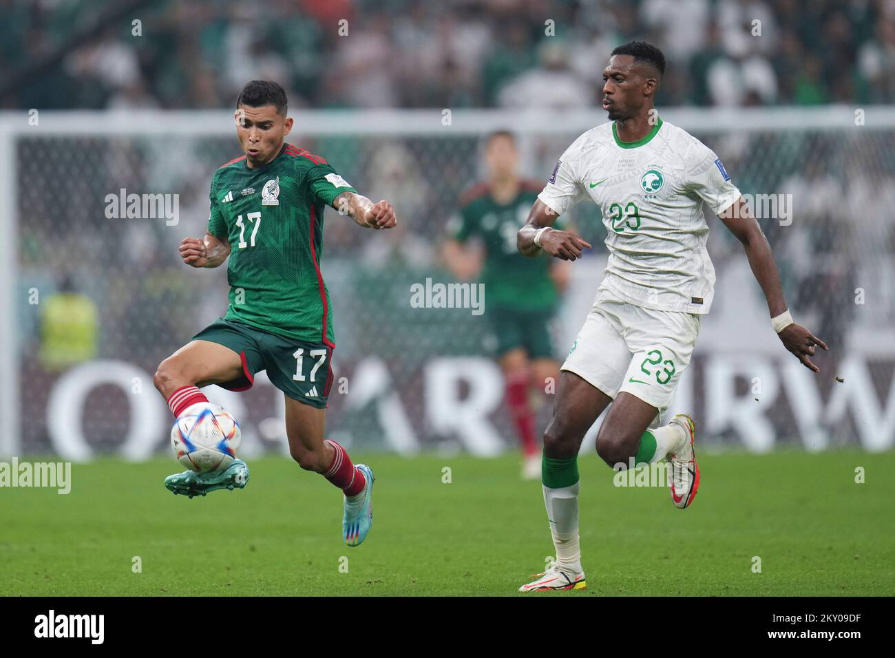 Lusail, Qatar. 30th Nov, 2022. Orbelin Pineda (L) of Mexico vies with Mohamed Kanno of Saudi Arabia during the Group C match between Saudi Arabia and Mexico at the 2022 FIFA World Cup at Lusail Stadium in Lusail, Qatar, Nov. 30, 2022. Credit: Meng Dingbo/Xinhua/Alamy Live News Stock Photo