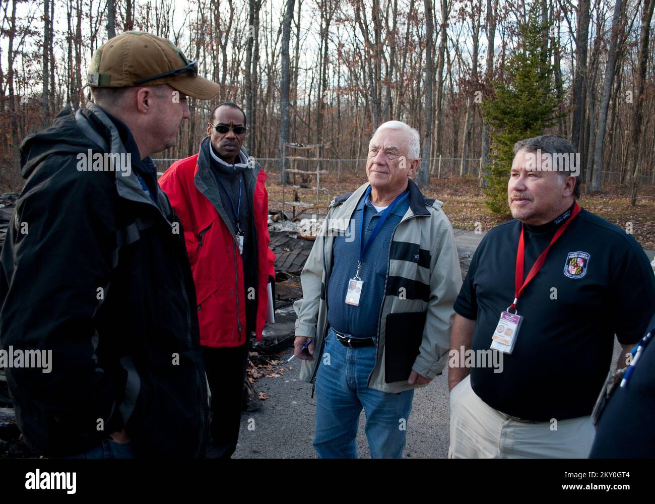 Oakland, Md., Nov. 15, 2012   (from left) James Taylor, FEMA Warren Adams, MD DHR, Duane Woodruff, Small Business Administration, and Brad Frantz, director of Garrett County Public Safety and Emergency Management, check a home that burned to the ground from Hurricane Sandy in Garrett County, MD. FEMA and county officials were assessing the effects from Hurricane Sandy in Oakland, MD, and Garrett County. Maryland Hurricane Sandy. Photographs Relating to Disasters and Emergency Management Programs, Activities, and Officials Stock Photo