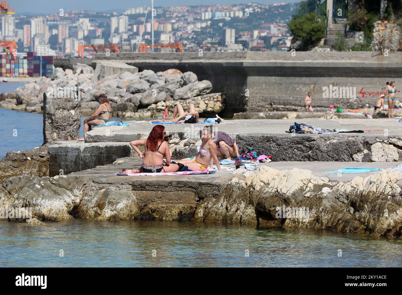 Citizens enjoying on the Grcevo beacg in Rijeka on June 5, 2022. High temperatures in Croatia are forcing citizens to find a way to cool down. Most found their summer comfort on the Grcevo beach - whether it's swimming in the Adriatic sea or sunbathing. Photo: Goran Kovacic/PIXSELL  Stock Photo