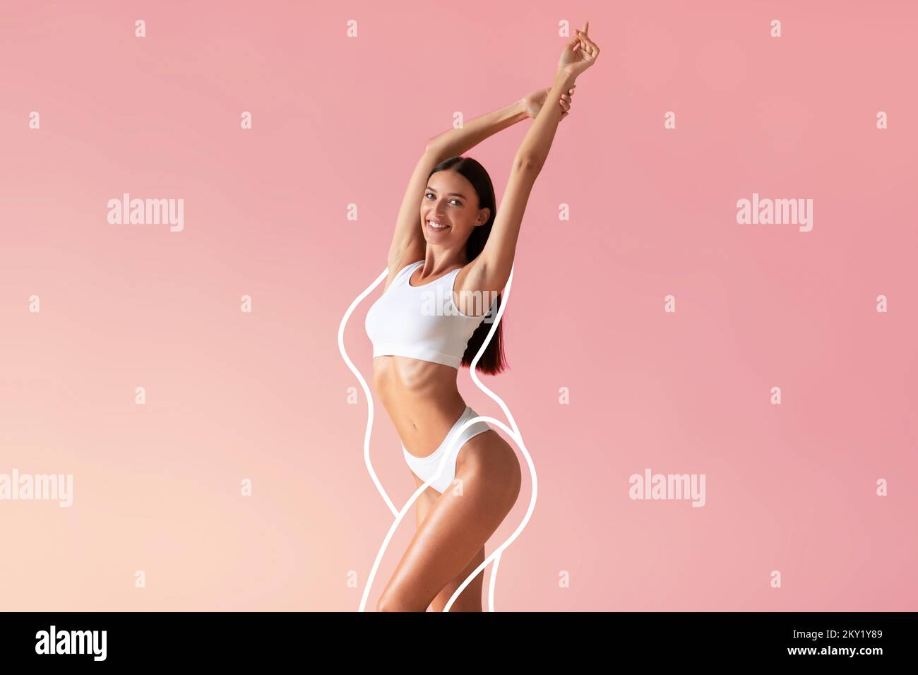 Wellness Concept. Happy slim woman in underwear posing with hands raised up Stock Photo
