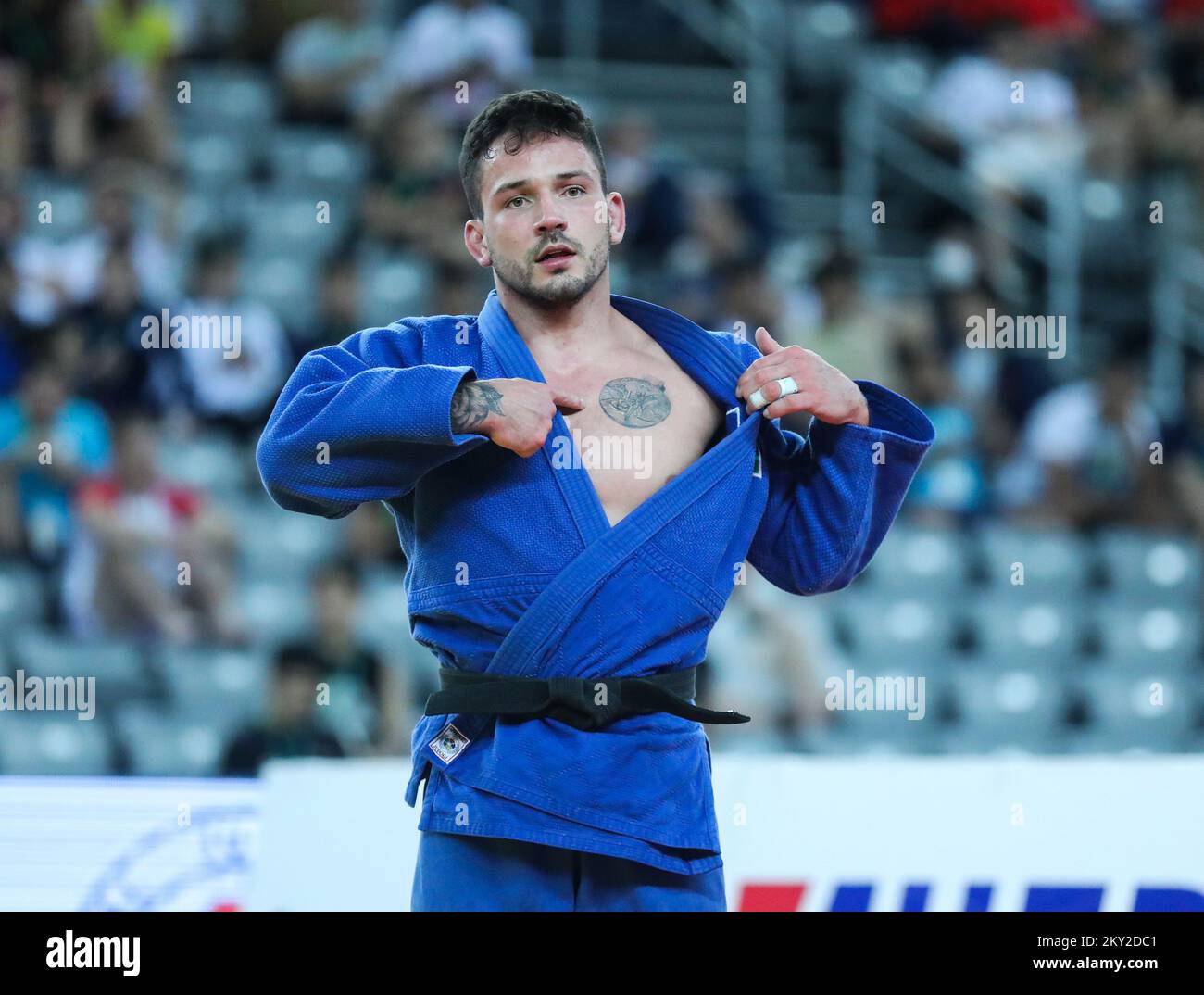 Daniel Cargnin of Brazil shows his tattoo after winning bronze in the category of men up to 73kg during the IJF World Tour Zagreb Grand Prix, held at the Zagreb Arena, in Zagreb, Croatia, on July 16, 2022. Photo: Zeljko Hladika/PIXSELL Stock Photo