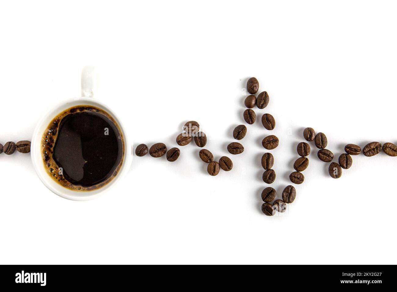 Cardiogram from coffee beans. White background. Stock Photo