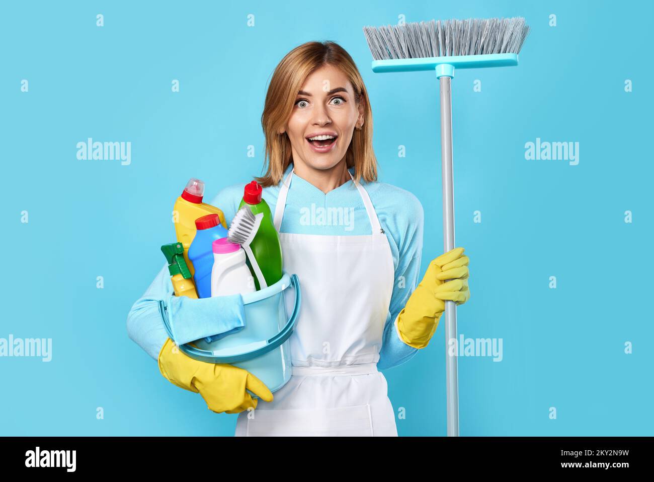 woman in gloves holding bucket of detergents and broom Stock Photo - Alamy