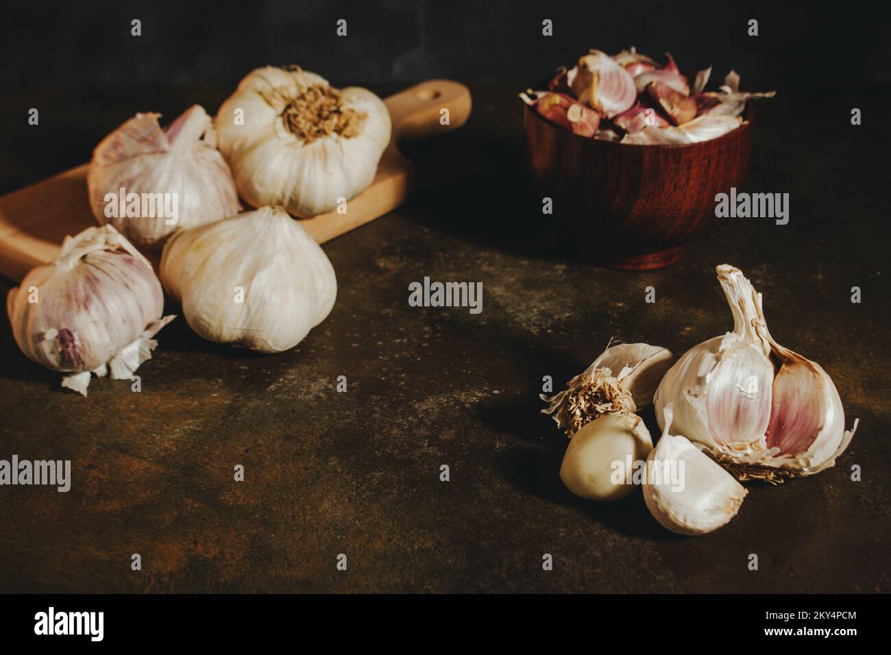 Garlic press with garlic cloves Stock Photo Alamy