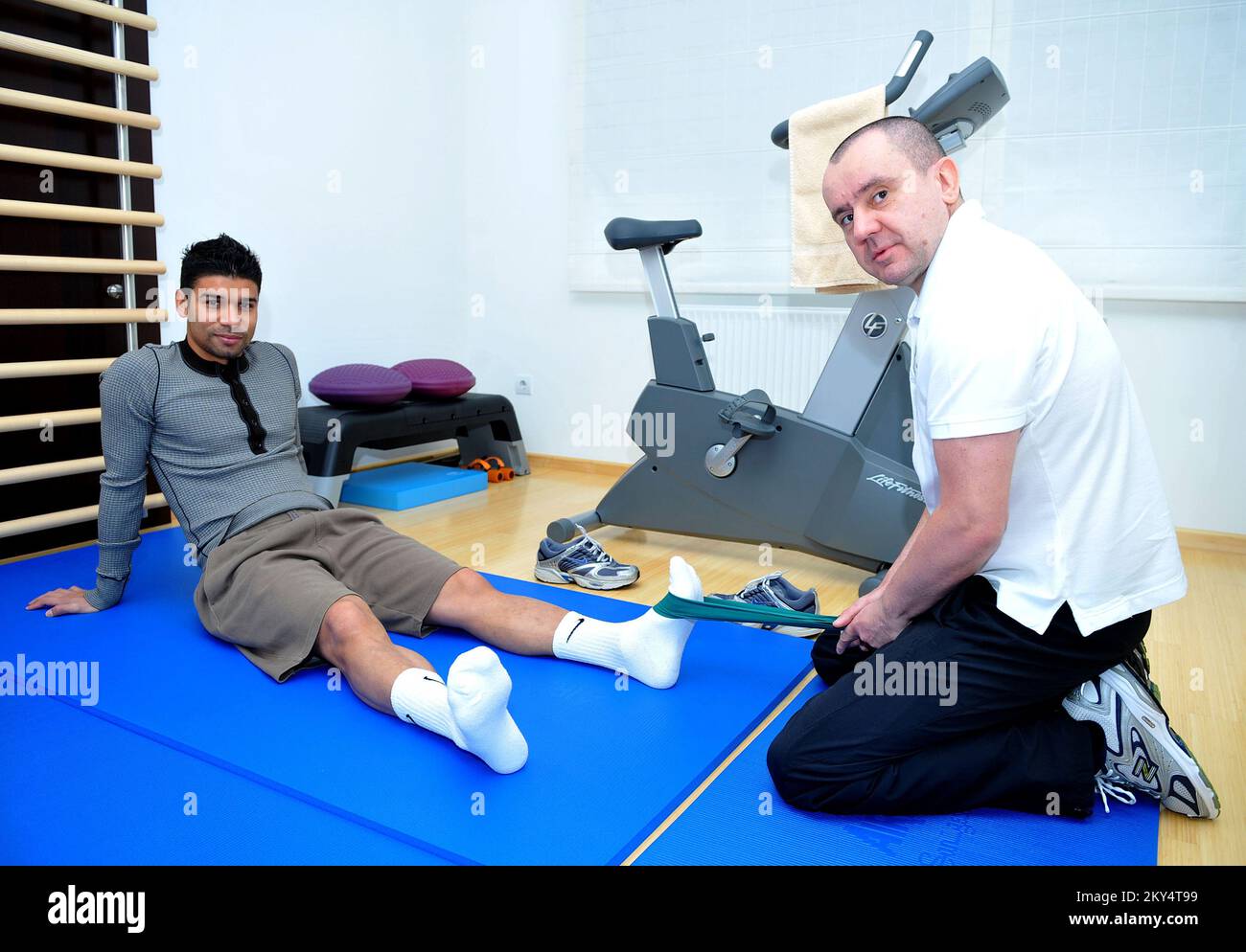 Arsenal's Eduardo da Silva with Physiotherapist Bojan Radanovic who is  helping him recover from his injury sustained from Blackburn Rovers' player  Martin Taylor after a serious foul resulting in Eduardo's broken leg