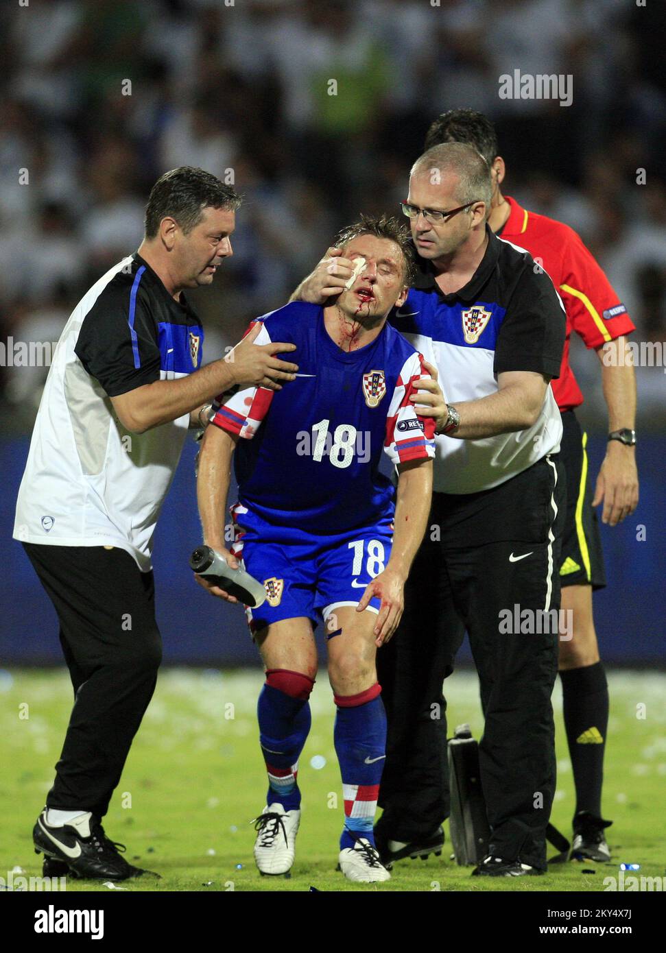 Croatia's Ivica Olic leaves the pitch after sustaining an injury. Stock Photo