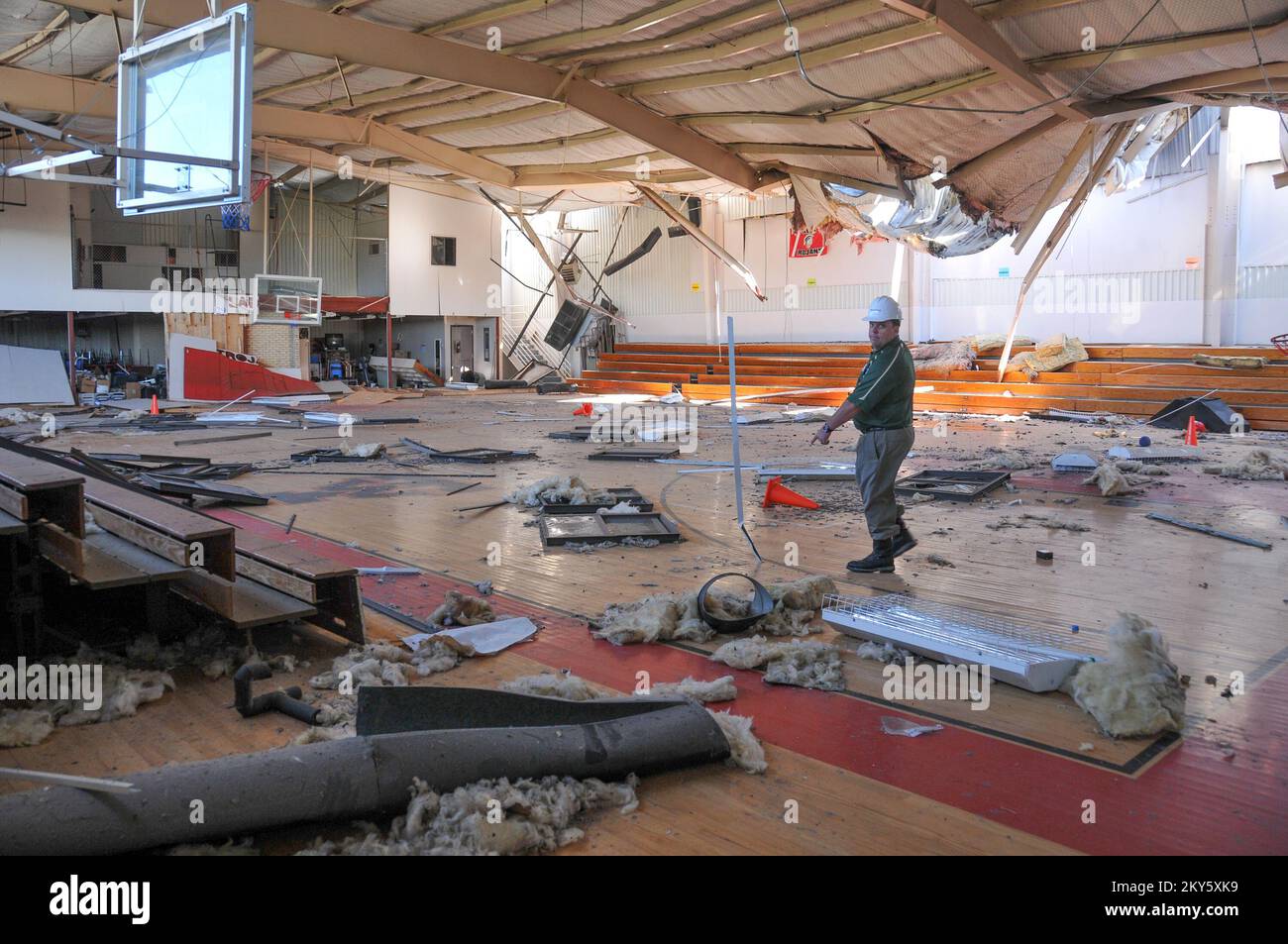 West, Texas, May 7, 2013   Marty Crawford, superintendent of the West Independent School District, walks through the gymnasium of the West Intermediate School during a joint state-federal preliminary damage assessment. The school, located only a short distance from the site of the April 17 fertilizer plant explosion, suffered extensive damage. FEMA is providing assistance to help the community recover from the disaster. Norman Lenburg/FEMA.. Photographs Relating to Disasters and Emergency Management Programs, Activities, and Officials Stock Photo