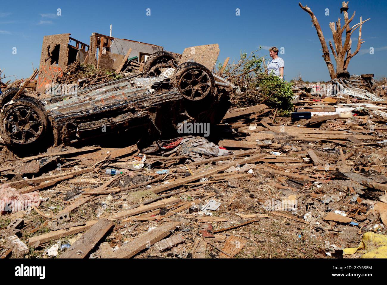Moore, Okla., May 22, 2013   Moore resident looks at home destruction caused by an F5 tornado that struck on May 20. Andrea Booher/FEMA.. Photographs Relating to Disasters and Emergency Management Programs, Activities, and Officials Stock Photo