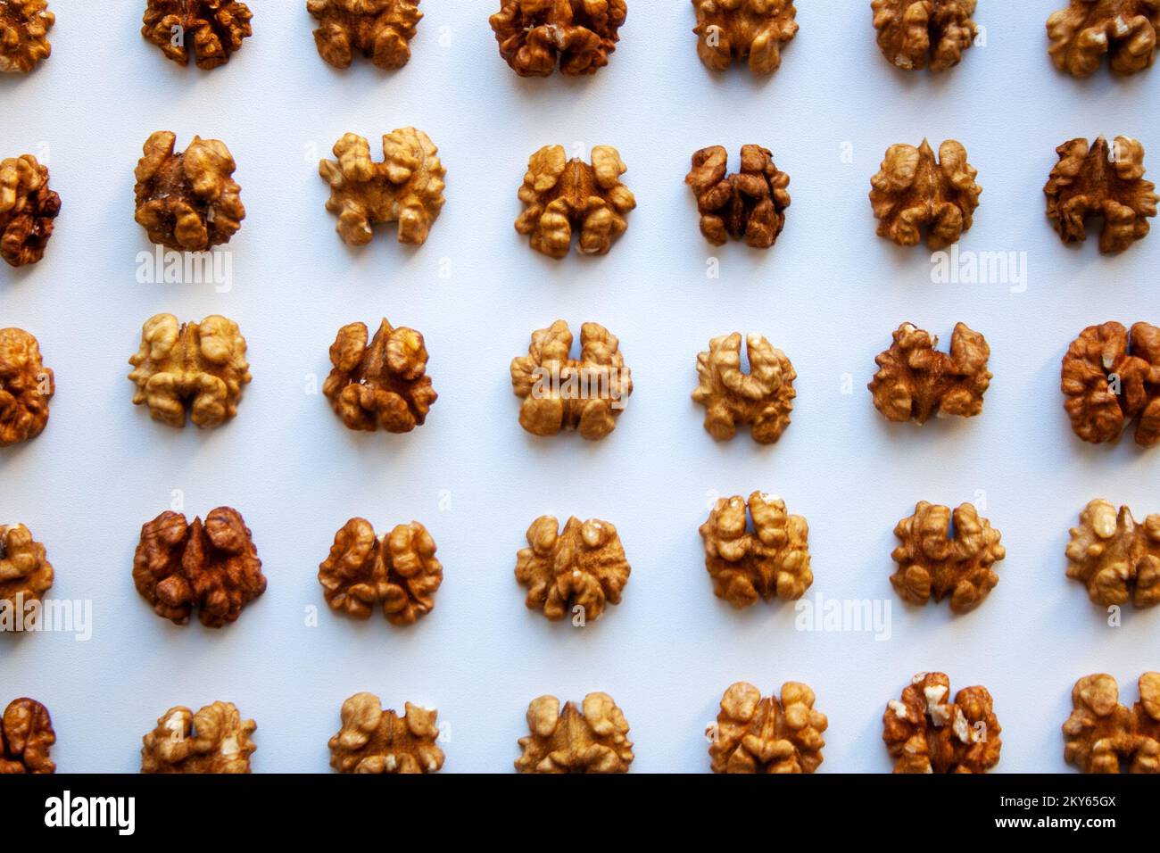 Raw walnuts meats pattern isolated on white background from a high angle view Stock Photo