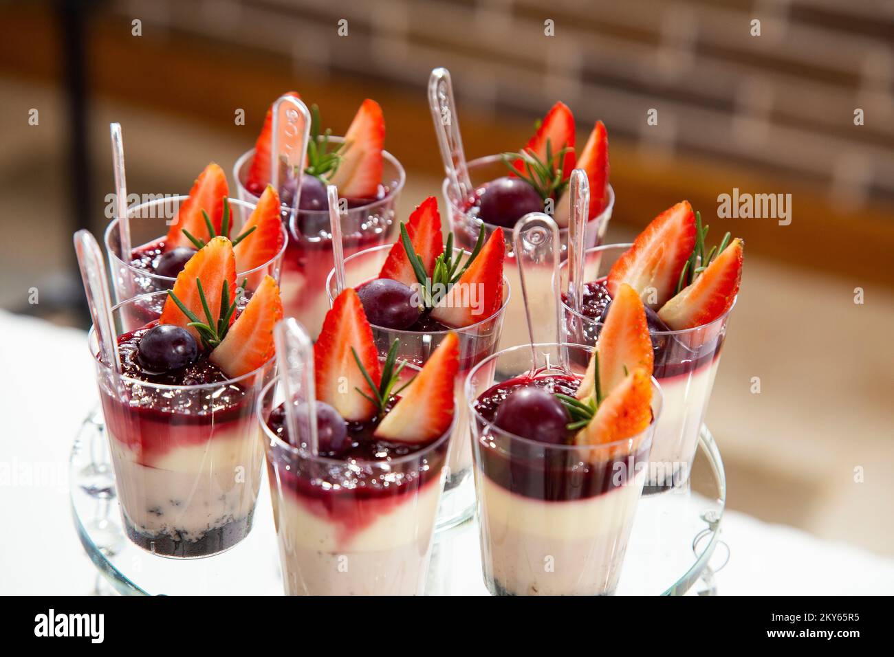 Mousses with berries on the dessert table for a party Stock Photo