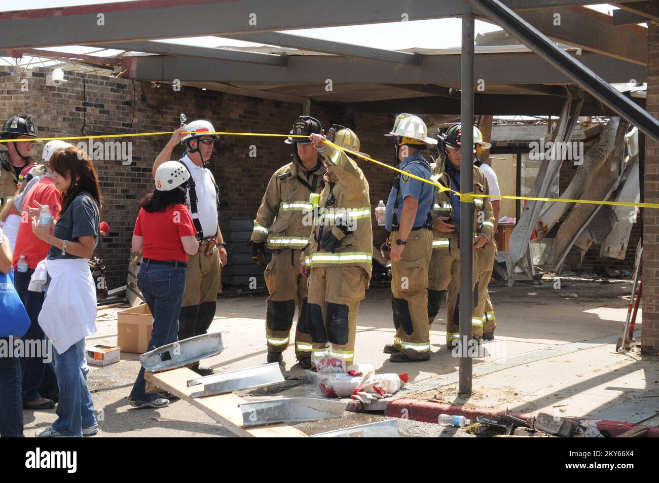 Firemen Escort Teachers and Students to Look for Possessions.. Photographs Relating to Disasters and Emergency Management Programs, Activities, and Officials Stock Photo
