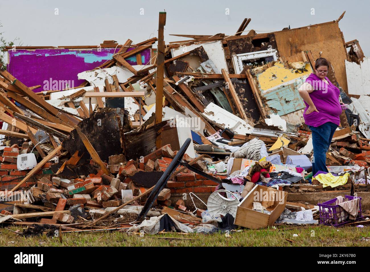 Moore, Okla., May 23, 2013   Moore resident, Brenda McCalister helps her brother look for personal belongings after a F5 tornado struck the town on May 20th. Andrea Booher/FEMA.. Photographs Relating to Disasters and Emergency Management Programs, Activities, and Officials Stock Photo