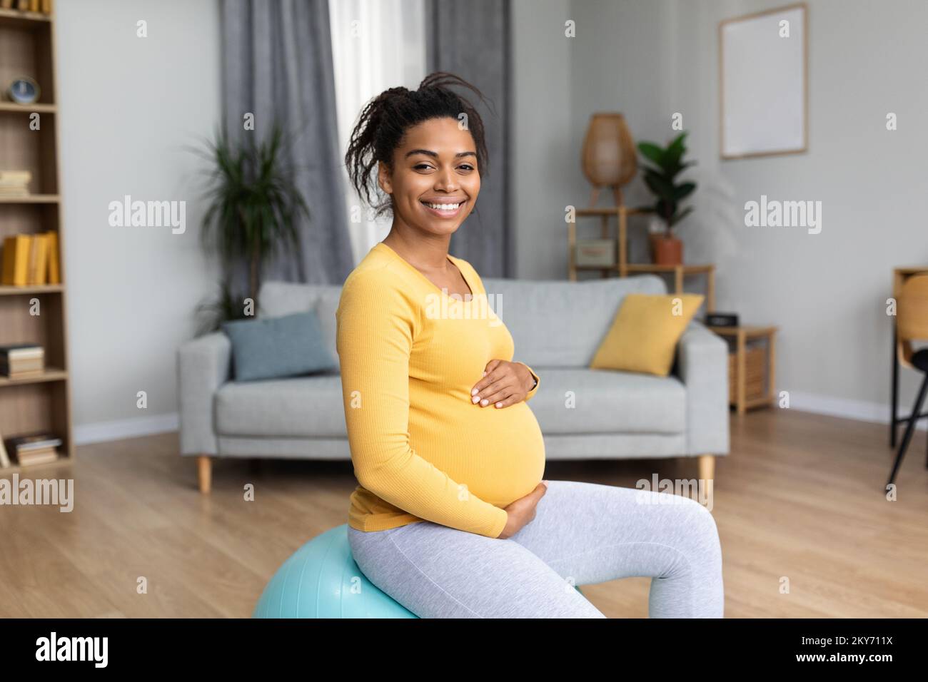 Cheerful young black pregnant lady future mom with big belly do