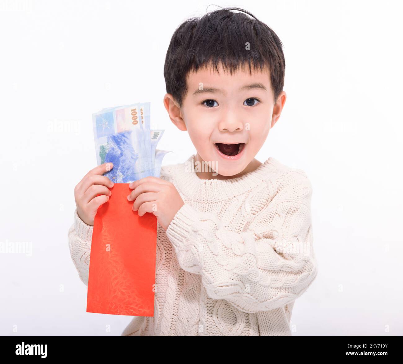 Happy Asian kid showing money and holding  red envelope . Happy Chinese New Year Concept. Stock Photo