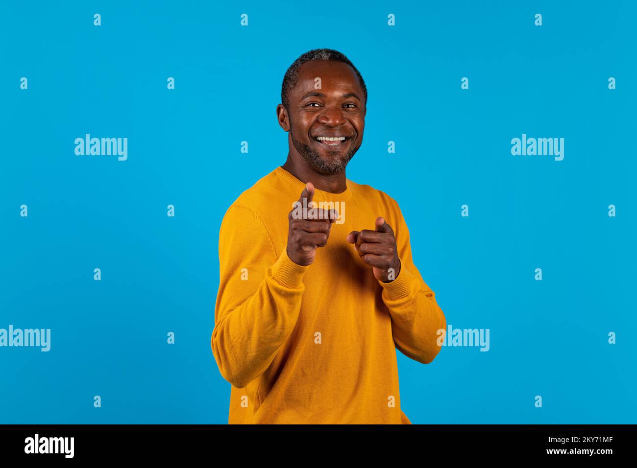 Charismatic handsome black man pointing at camera Stock Photo - Alamy