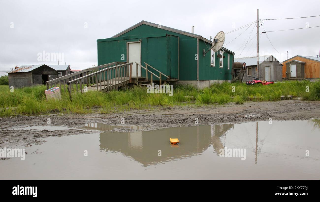 Emmonak, Alaska, July 15, 2013   All that remains are mud puddles and saturated tundra in this village after severe flooding innundated the Bourough and caused massive damages to individuals and businesses. Individuals and business owners who sustained losses in the designated areas can begin applying for assistance by registering online at www.disasterassistance.gov or by calling 1-800-621-FEMA. Adam DuBrowa/ FEMA.. Photographs Relating to Disasters and Emergency Management Programs, Activities, and Officials Stock Photo