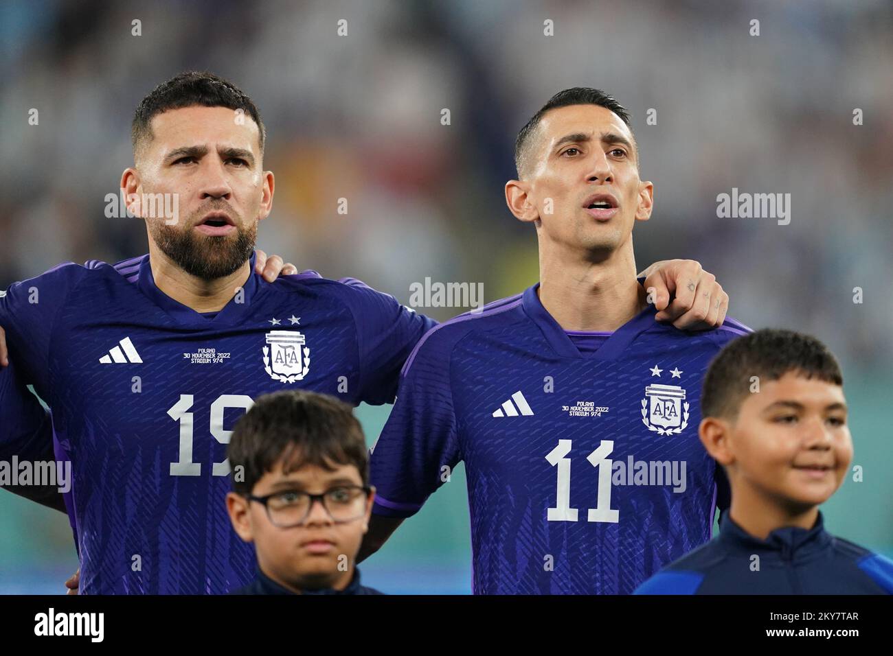 DOHA, QATAR - NOVEMBER 30: Player of Argentina Nicolás Otamendi and Ángel Di María sing the national anthem before the FIFA World Cup Qatar 2022 group C match between Argentina and Poland at Stadium 974 on November 30, 2022 in Doha, Qatar. (Photo by Florencia Tan Jun/PxImages) Credit: Px Images/Alamy Live News Stock Photo