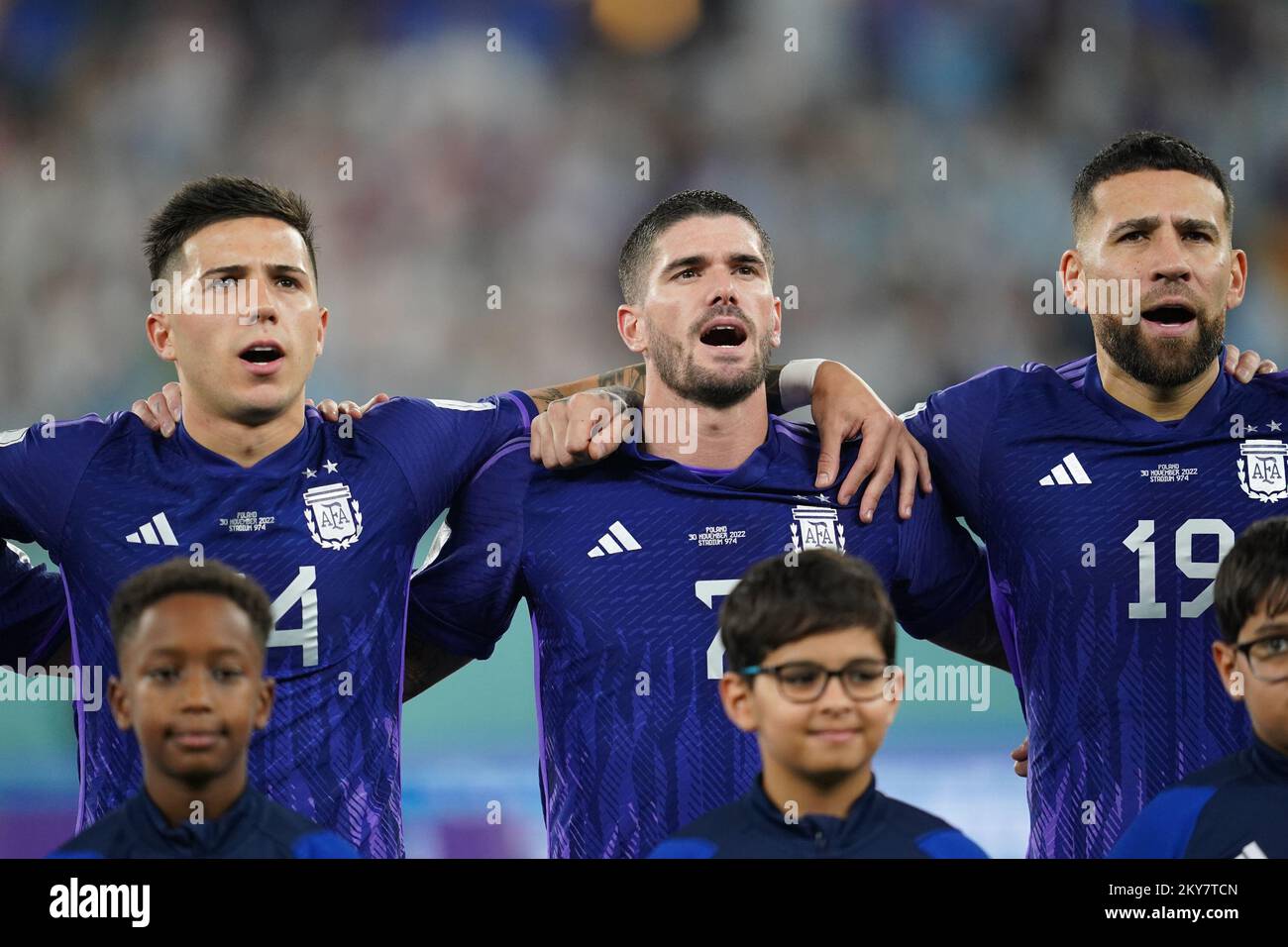 DOHA, QATAR - NOVEMBER 30: (L-C-R) Player of Argentina Enzo Fernández, Rodrigo De Paul and Nicolás Otamendi sing the national anthem before the FIFA World Cup Qatar 2022 group C match between Argentina and Poland at Stadium 974 on November 30, 2022 in Doha, Qatar. (Photo by Florencia Tan Jun/PxImages) Credit: Px Images/Alamy Live News Stock Photo