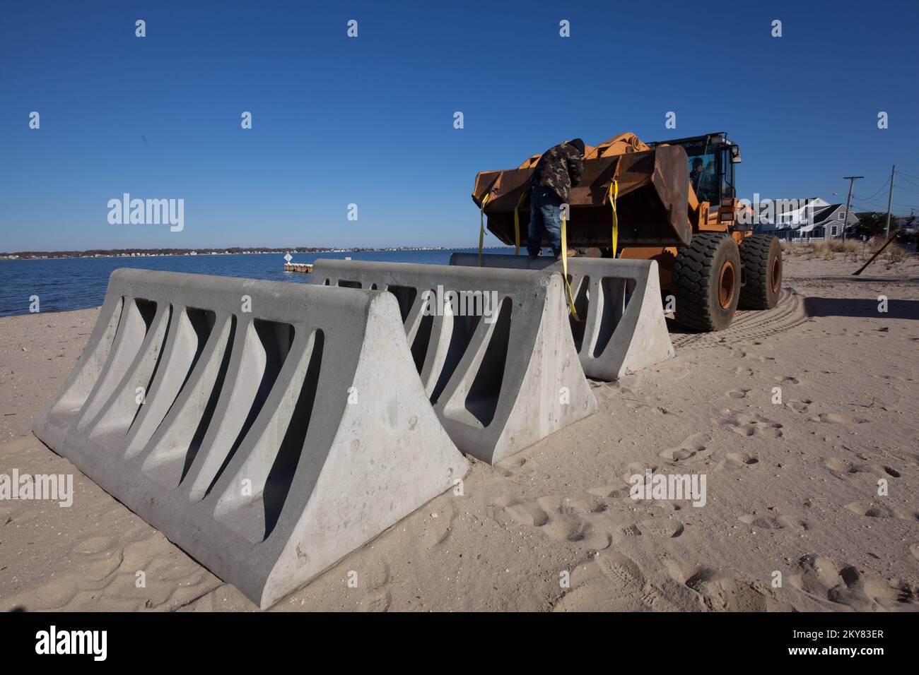 Ocean Gate N.J., November 26, 2013 A workers guides the placement of