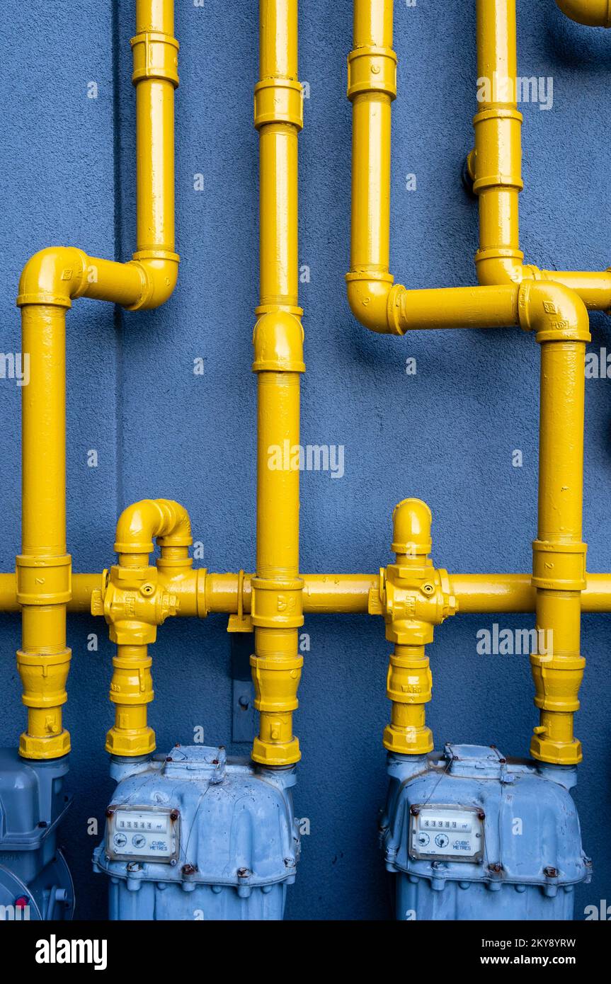 Yellow painted pipes connected to natural gas meters Stock Photo Alamy