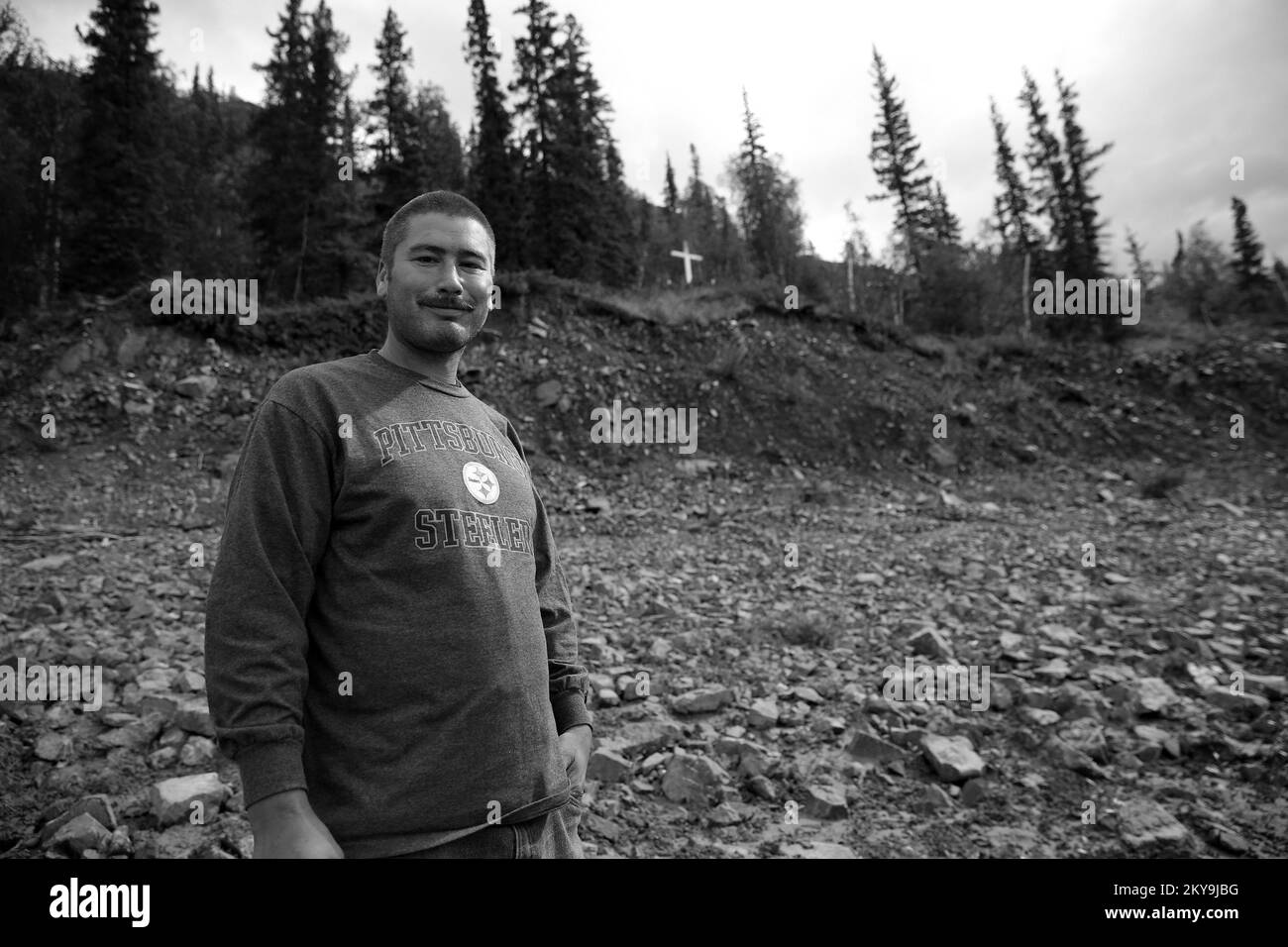 Circle, AK, July 16, 2014  Tribe member Jack Boyle visits the sacred Athabaskan burial ground after severe flooding has undermined the intergrity of the riparian coridor. FEMA, The State of Alaska and the Tribal Entity of Circle are working together to mitigate further future damages to the property. Adam DuBrowa/ FEMA. Alaska Flooding. Photographs Relating to Disasters and Emergency Management Programs, Activities, and Officials Stock Photo