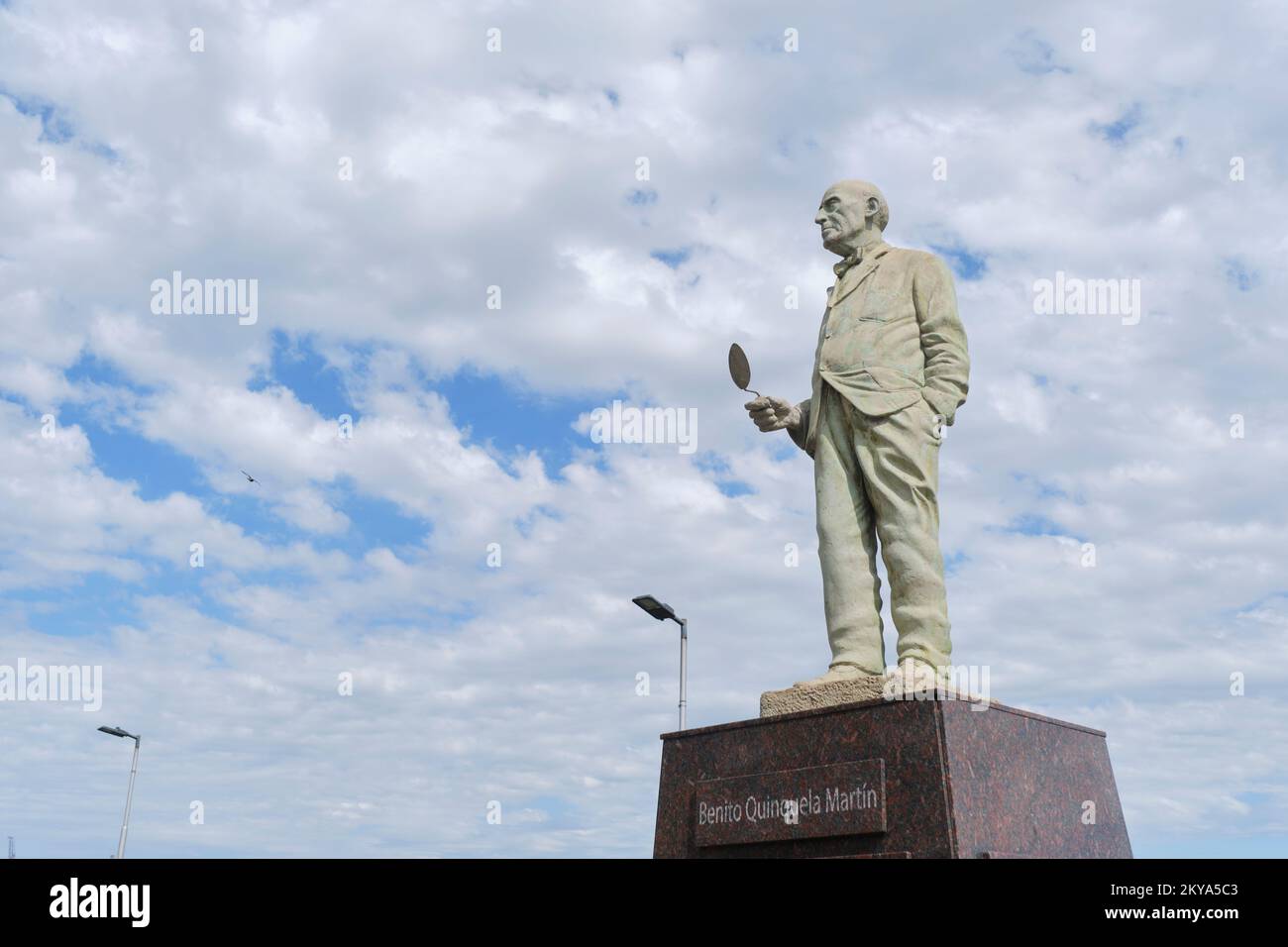 Dec 21, 2021, Buenos Aires, Argentina: sculpture of the painter and philanthropist Benito Quinquela Martin in La Boca neighborhood, his back to the Ri Stock Photo