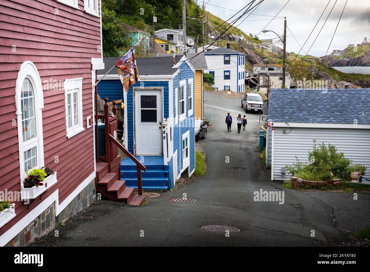 Tourists walk through jelly bean homes through the Old Battery Road in